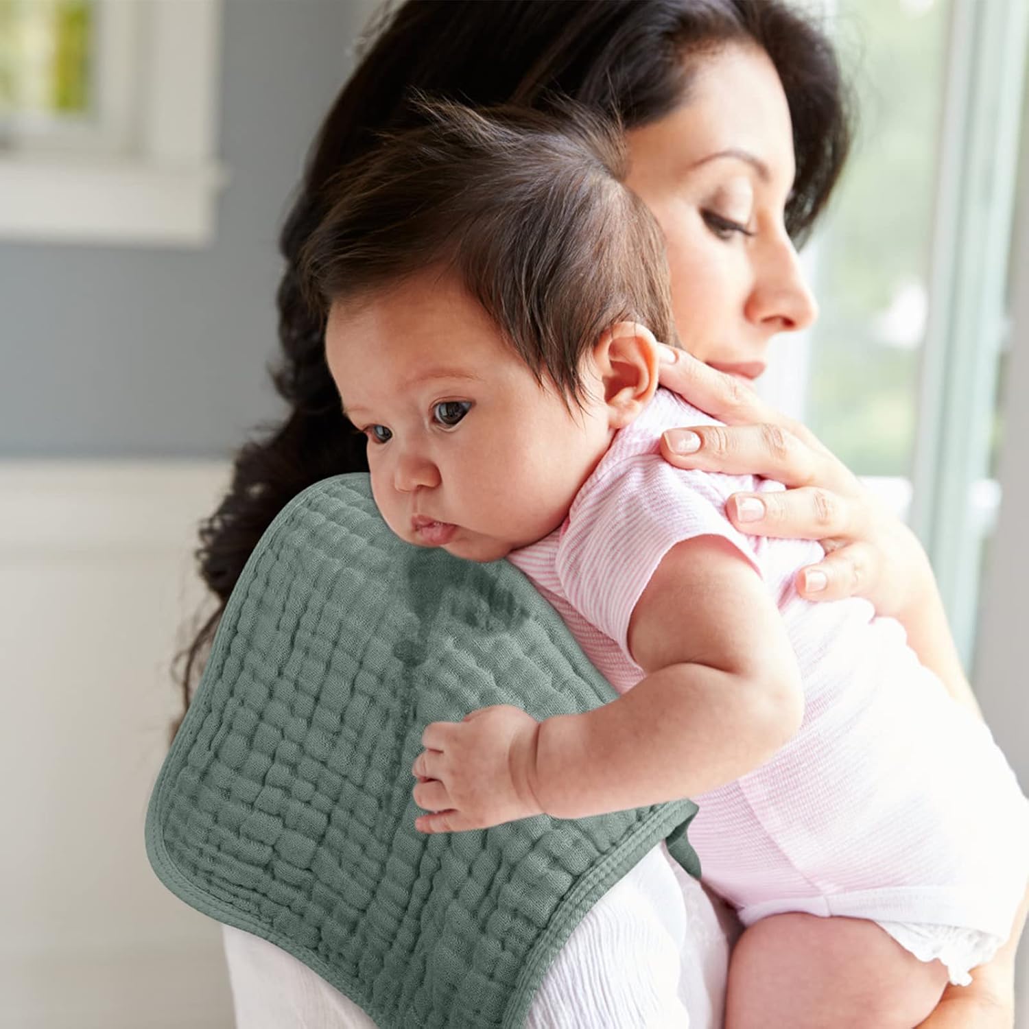 Shows the product in use, demonstrating how it provides comfort and support for both parent and baby during everyday care activities.