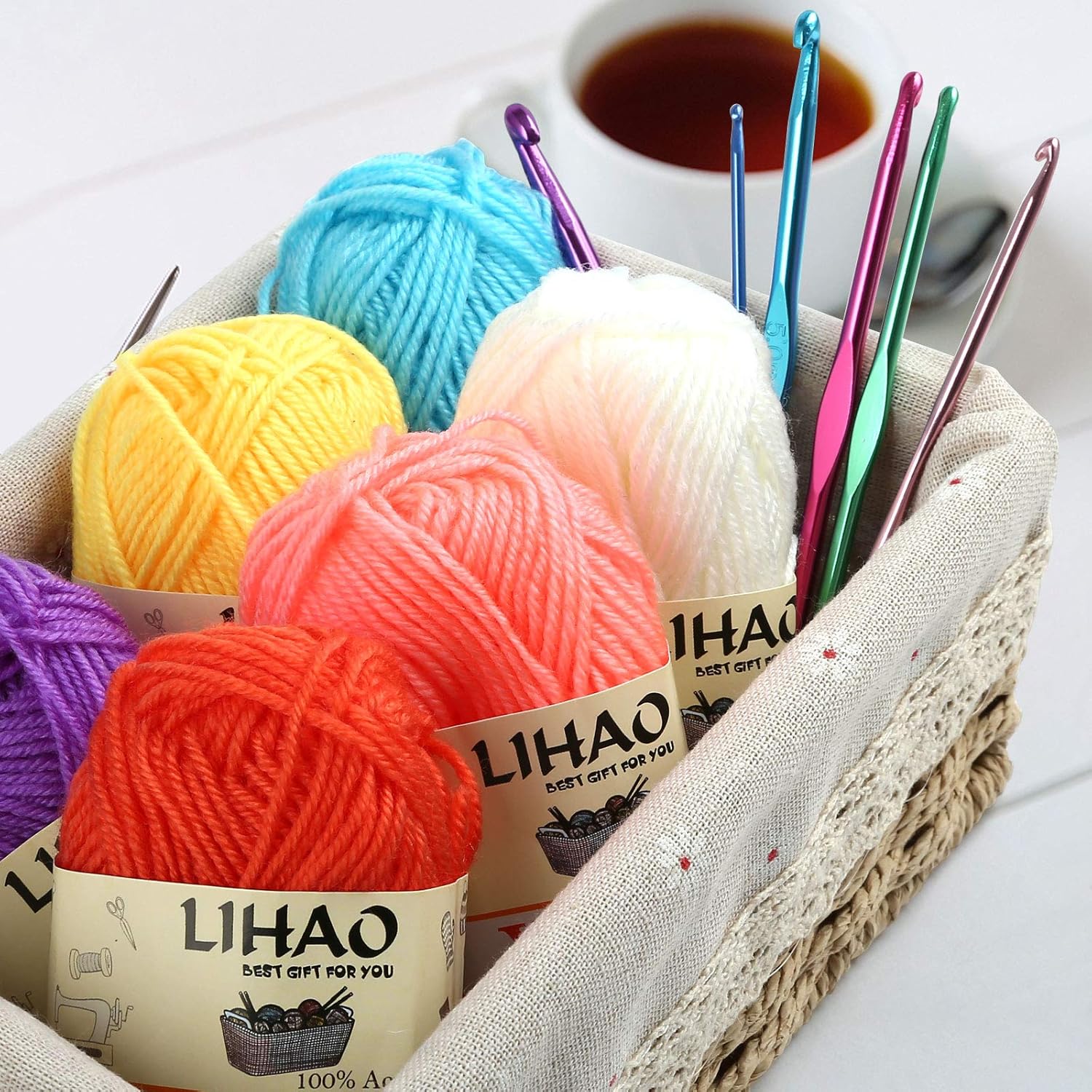 Shows the complete set of colorful yarn skeins and crochet hooks included in the product package, highlighting the variety and value for crafters.