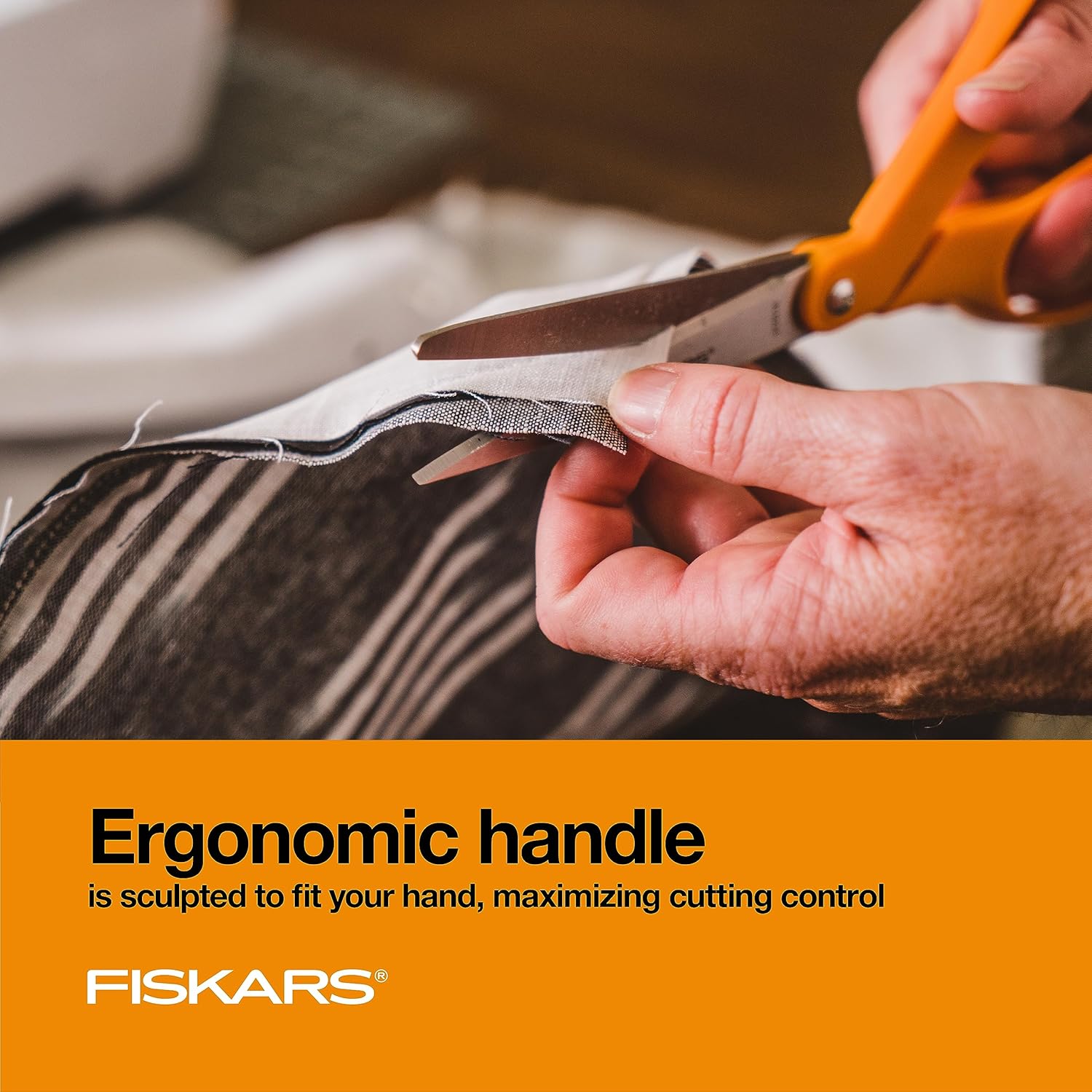 Highlights the ergonomic design of the scissors handle to emphasize improved comfort and control during use.