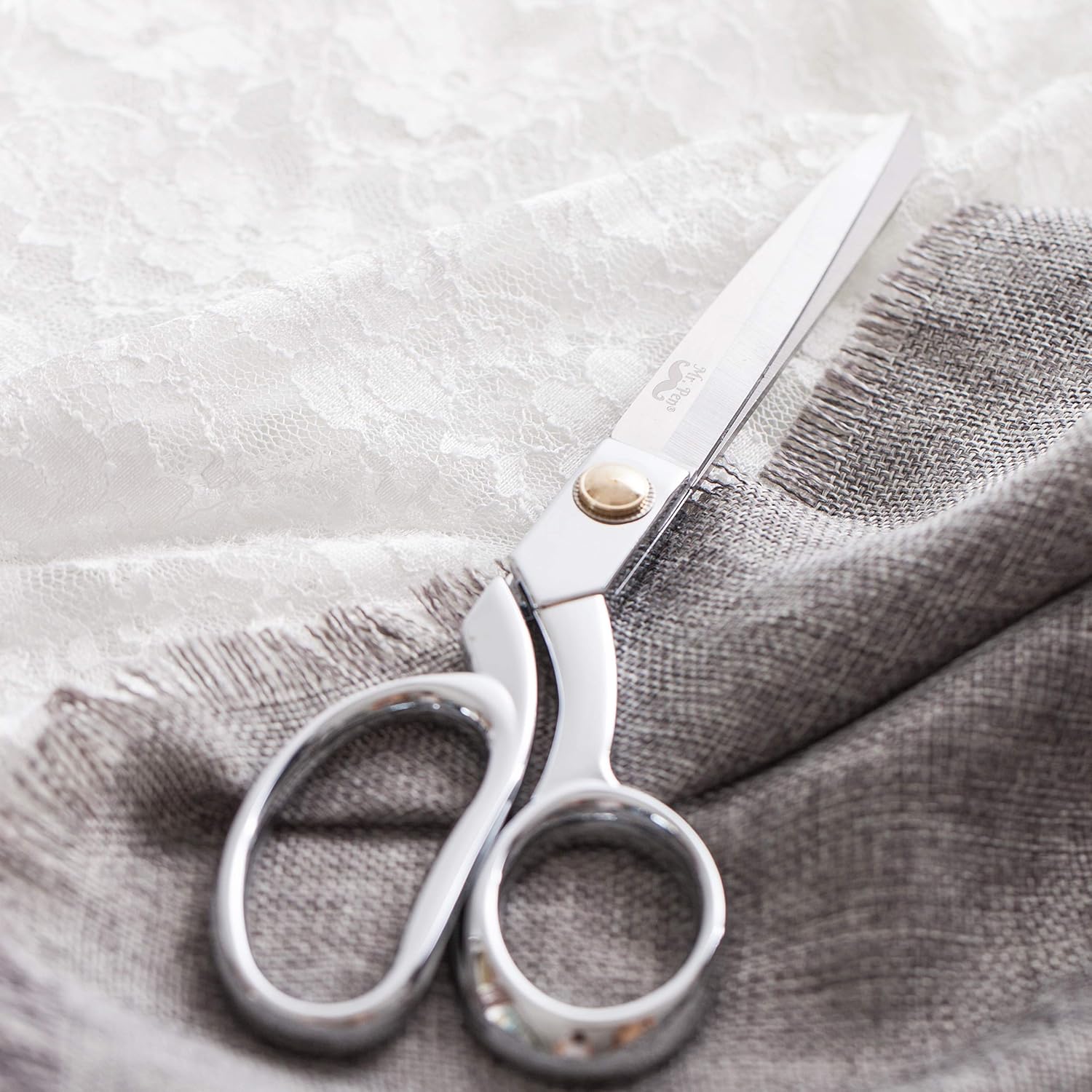 Highlights the high-quality craftsmanship of the scissors, suggesting precision and durability for sewing or crafting tasks.