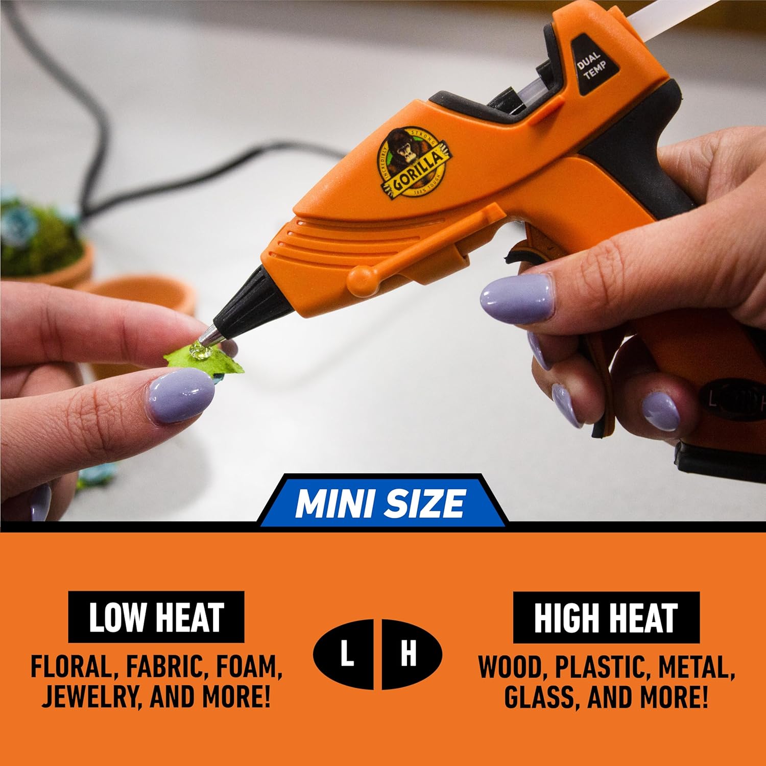 Demonstrates the compact size of the glue gun by showing it in use with small objects. Highlights the product's dual temperature settings and its ability to…