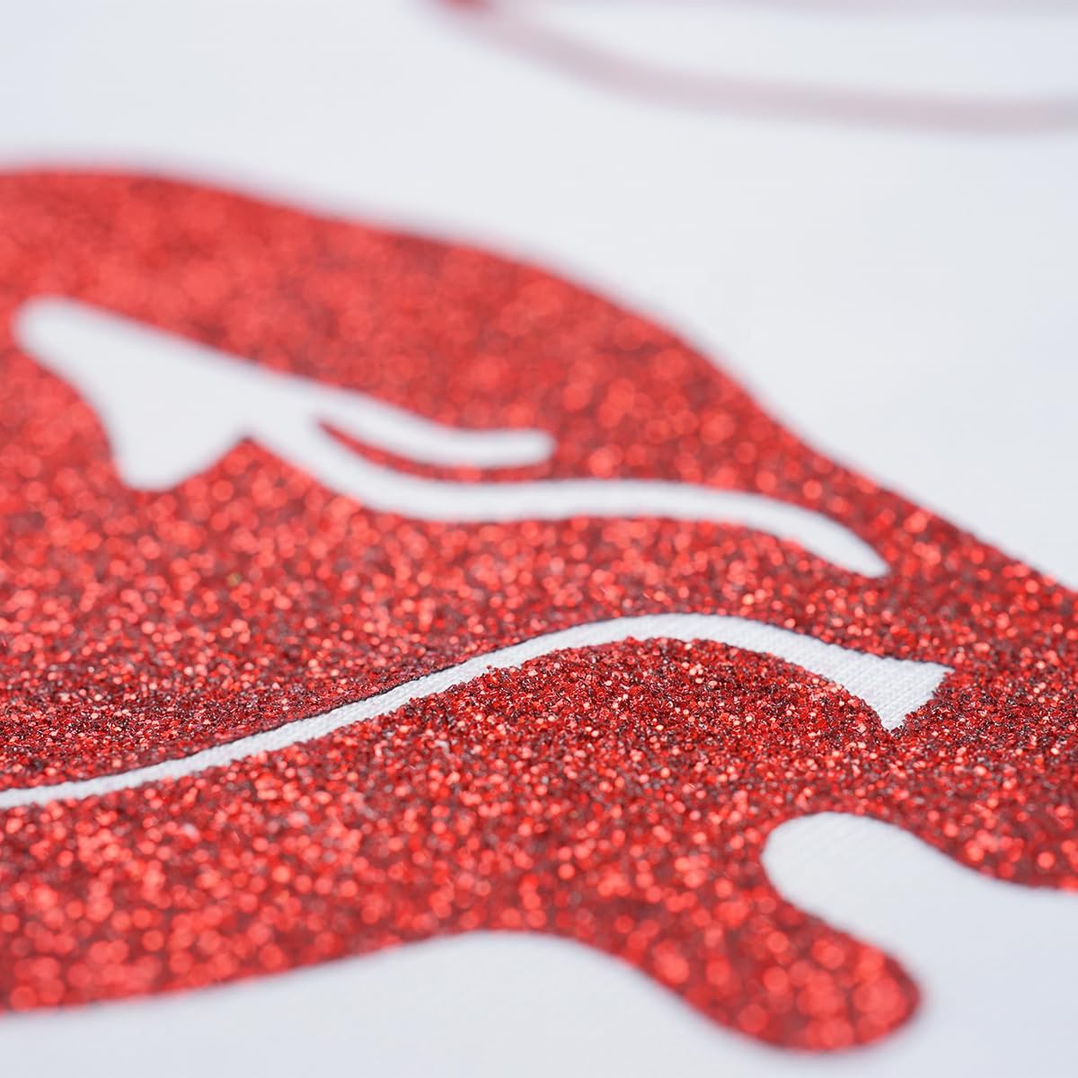 Highlights the product's glittery, sparkly texture to appeal to customers looking for decorative or festive items.