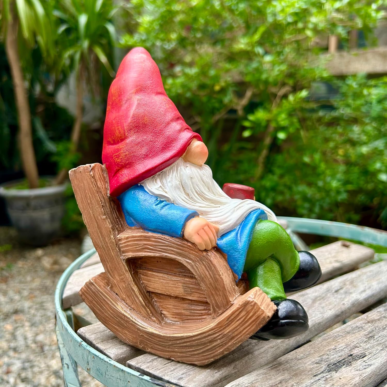 Shows the product in a natural garden setting to demonstrate how it can be used as outdoor decor.
