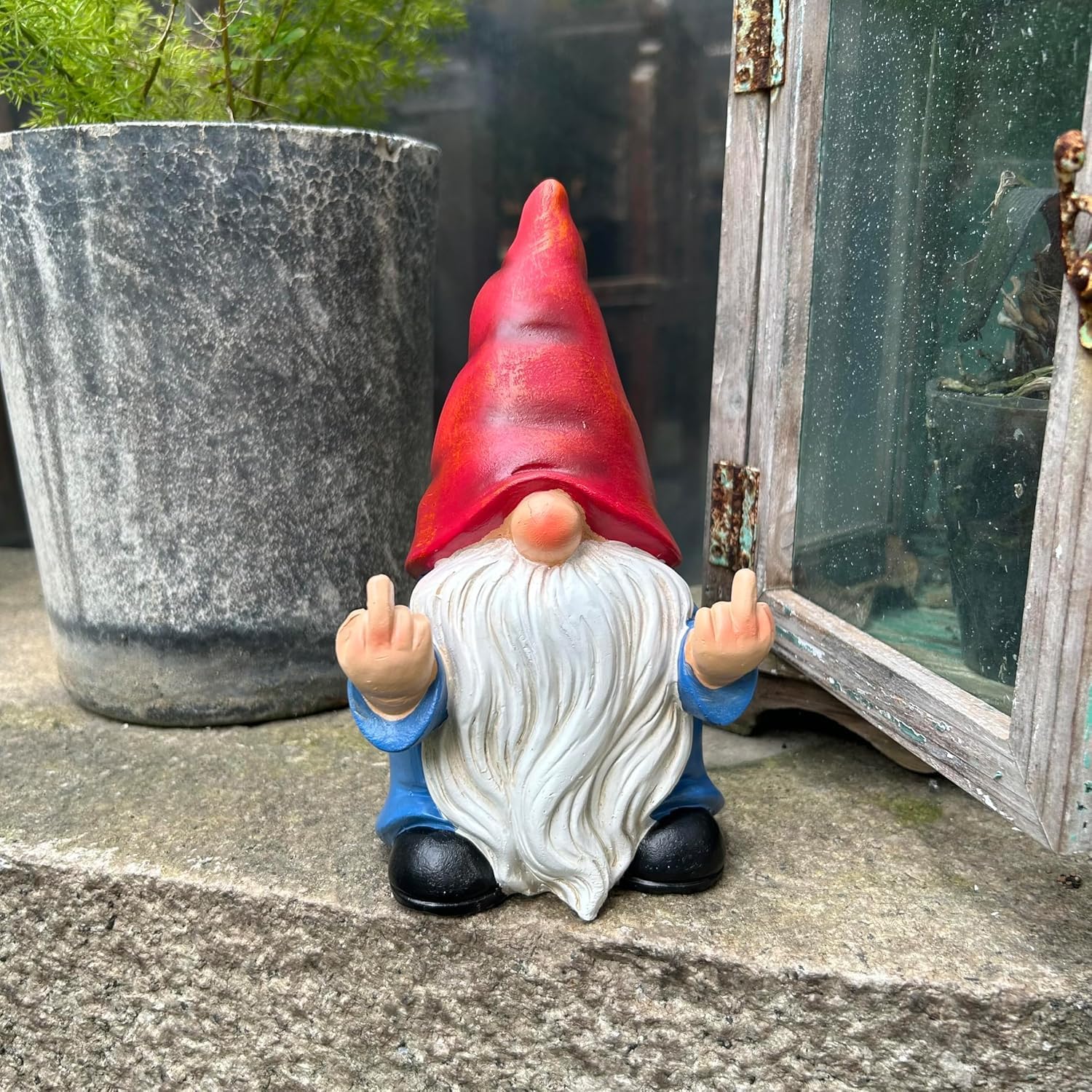 Shows the product in a realistic outdoor setting to demonstrate how it can be used as a humorous garden decoration.