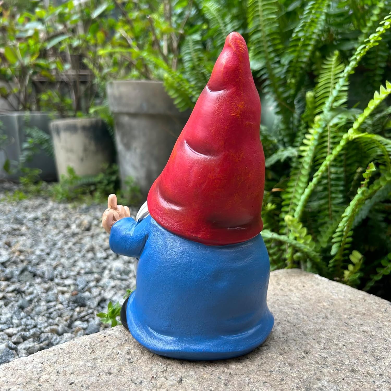 Shows the product in a natural garden setting to demonstrate how it can be used as outdoor decoration.