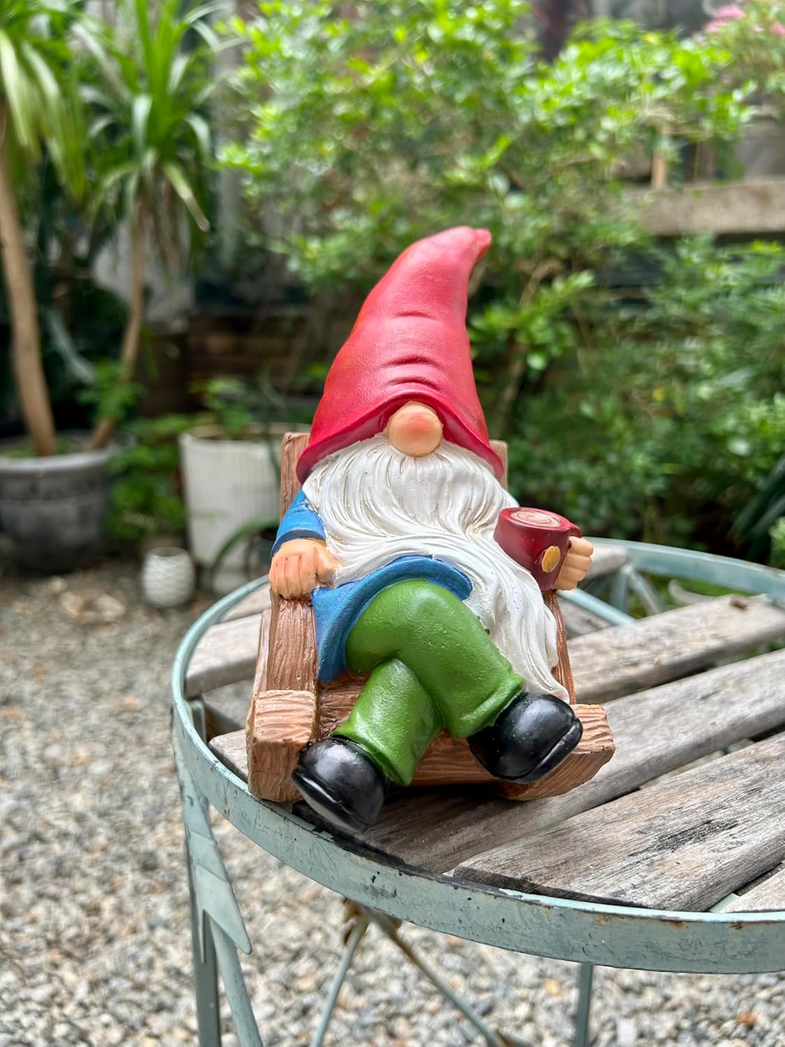 Shows the product in a natural outdoor setting to demonstrate its use as garden decoration.