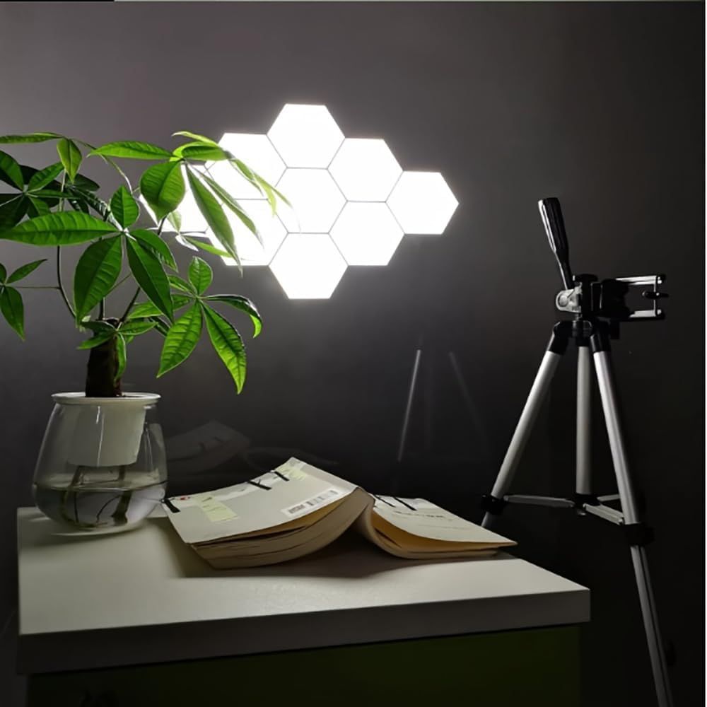 Shows the hexagonal wall lights in a real-world home office or workspace setting to help shoppers visualize how the product looks when installed and illuminated in their own environment.