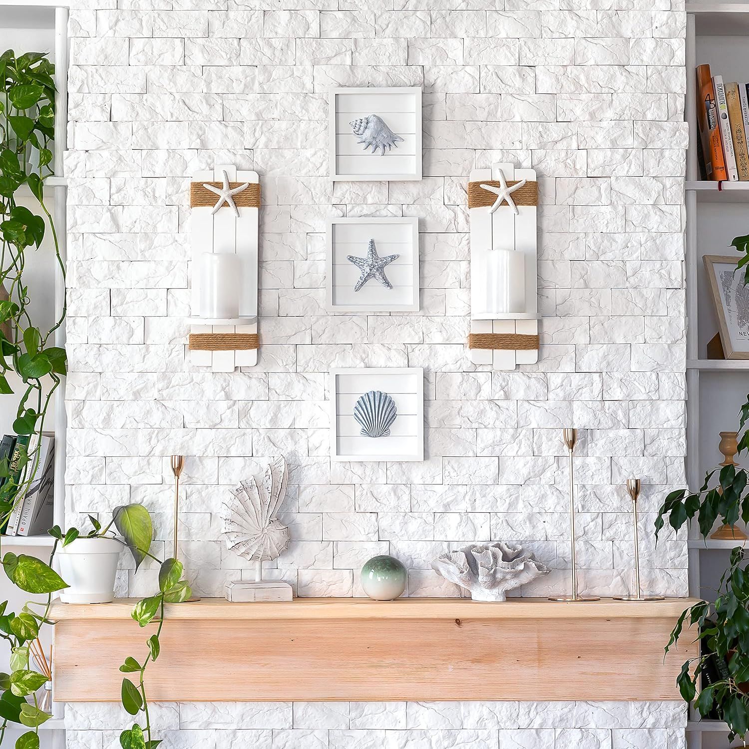 Shows the product in a real-world home setting to help shoppers visualize how the coastal-themed wall decor would look styled in their own space.