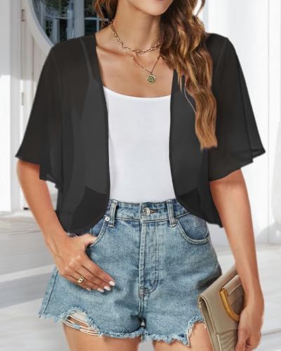 Shows the product worn in a natural setting to help shoppers visualize how the cardigan looks when styled with casual outfit pieces.