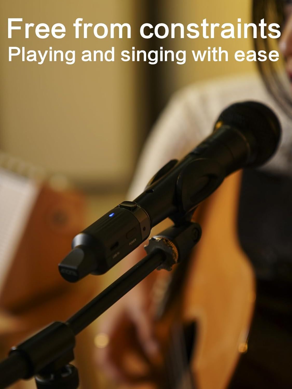 Communicates that the wireless microphone allows musicians to perform without being restricted by cables, enabling free movement while playing and singing.