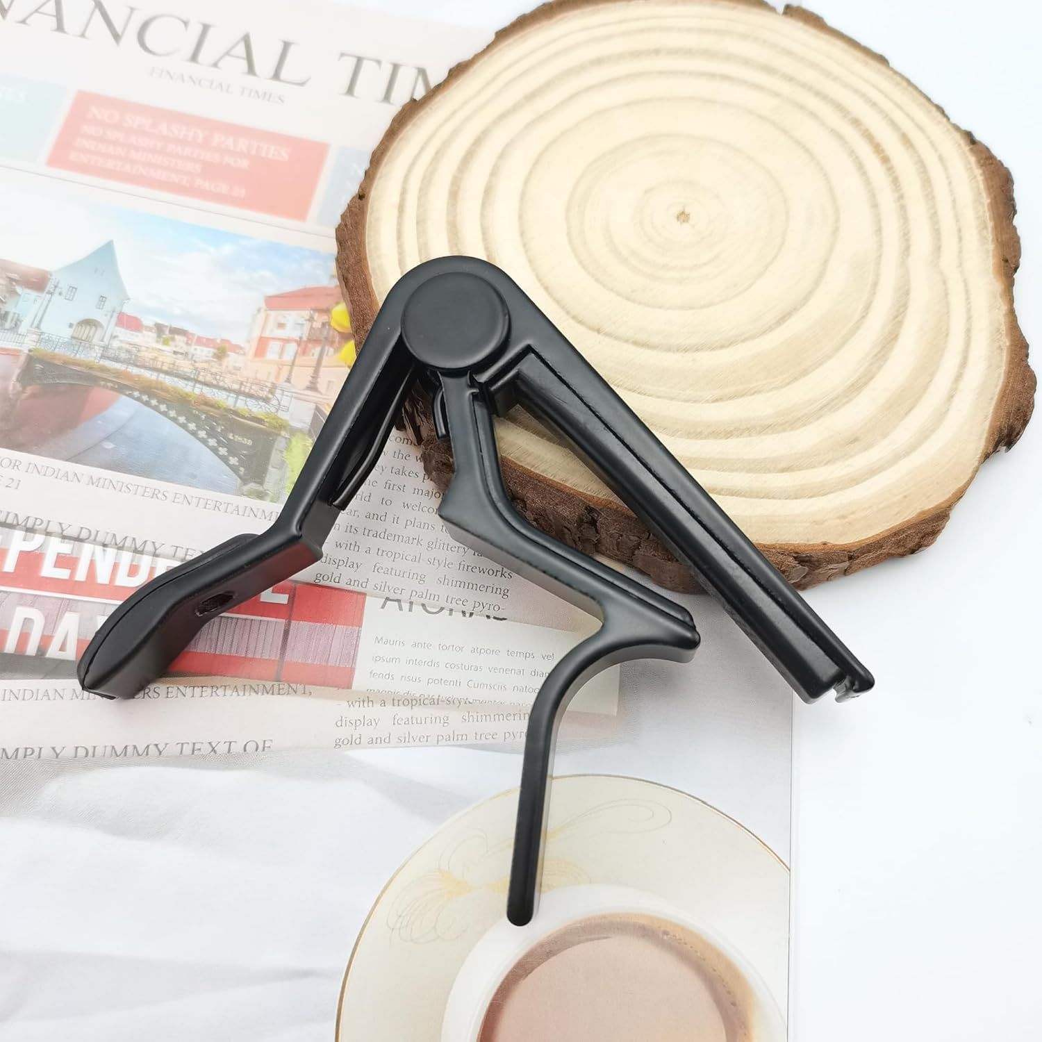 Shows the product in a natural setting with everyday items like a wood slice and newspaper to help shoppers visualize how it fits into their lifestyle.