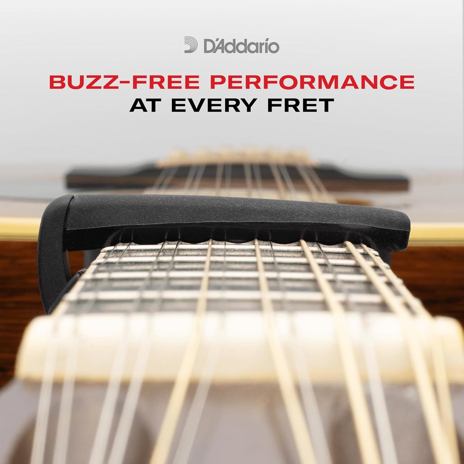 Communicates that the product eliminates unwanted fret buzz, ensuring clean sound quality at every fret position for guitar players.