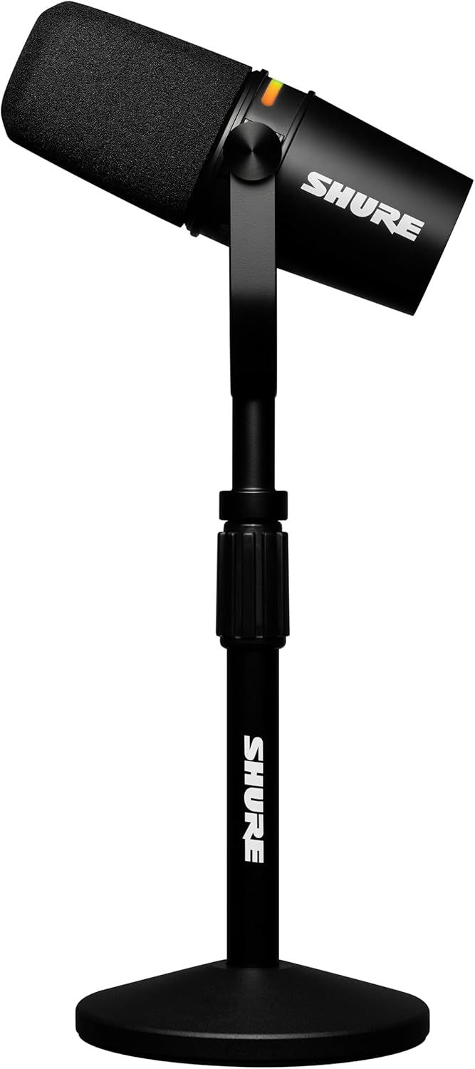 Shows the product in a clean, professional context to help shoppers visualize the microphone on a stand in a real-world recording or streaming environment.
