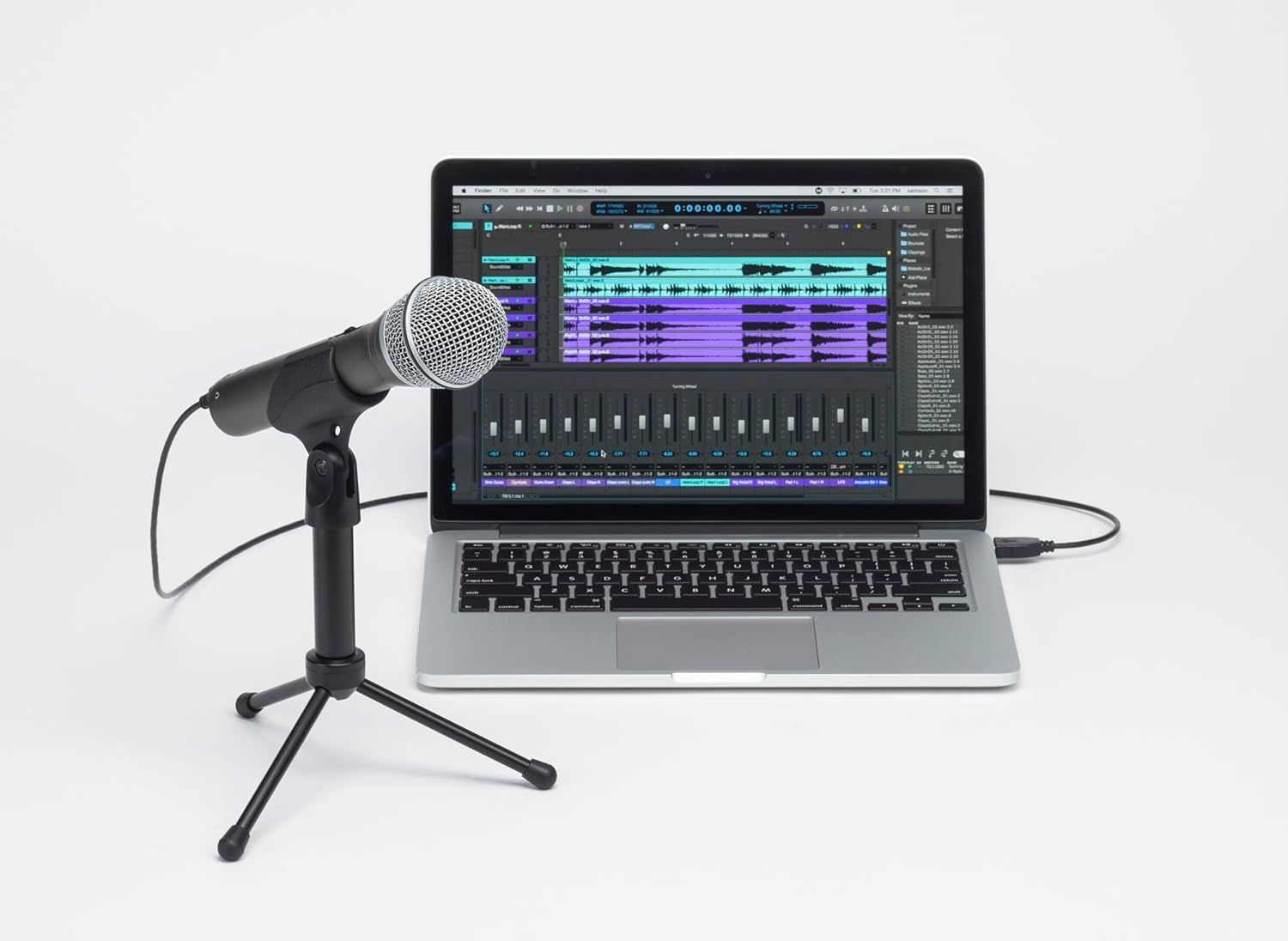 Demonstrates the microphone's use case for audio recording and music production by showing it connected to a laptop running audio editing software.