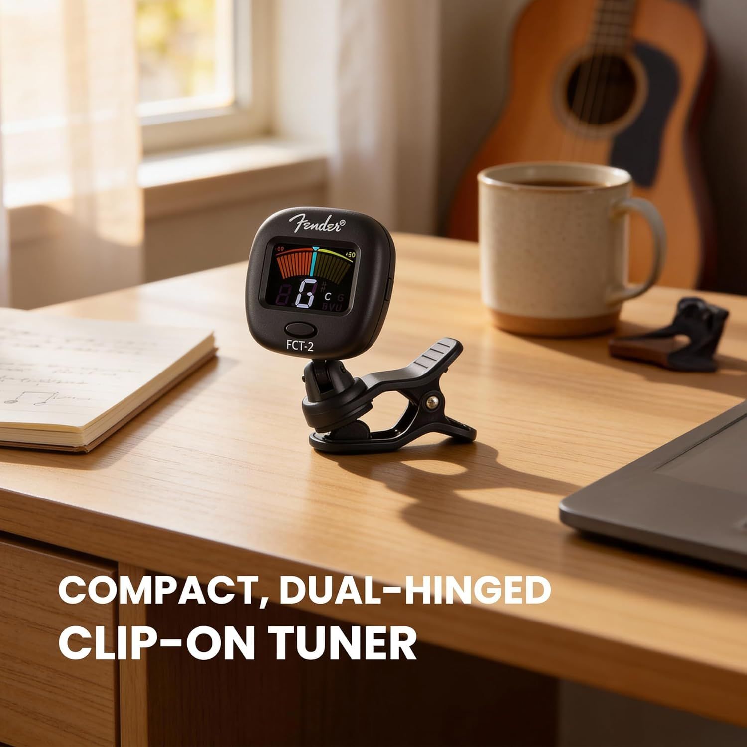 Communicates that the guitar tuner is both compact and features a dual-hinged clip-on design, making it versatile and easy to attach to instruments.