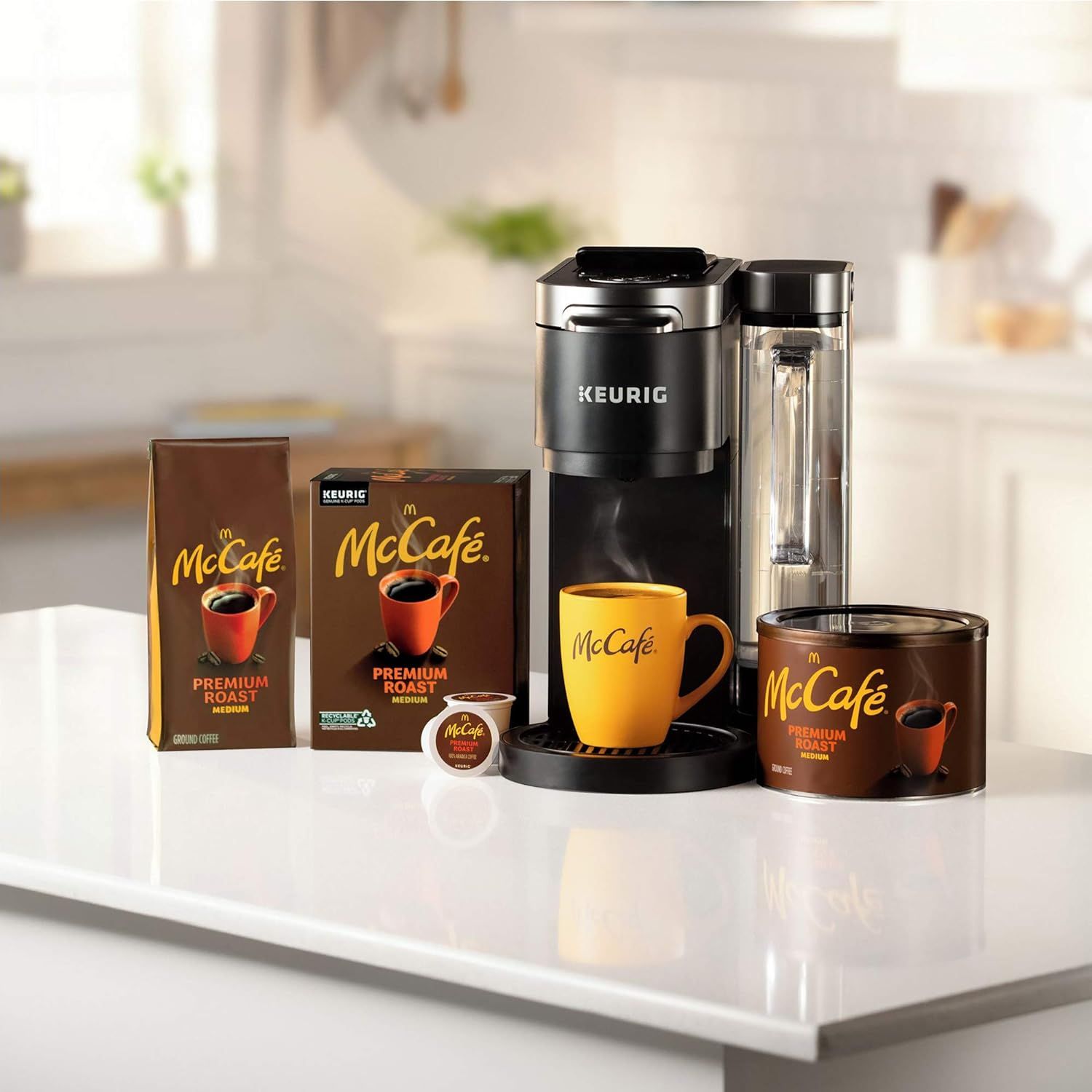 Shows the Keurig coffee maker in a real-world kitchen environment with McCafe coffee products to help shoppers visualize the product in their own home.