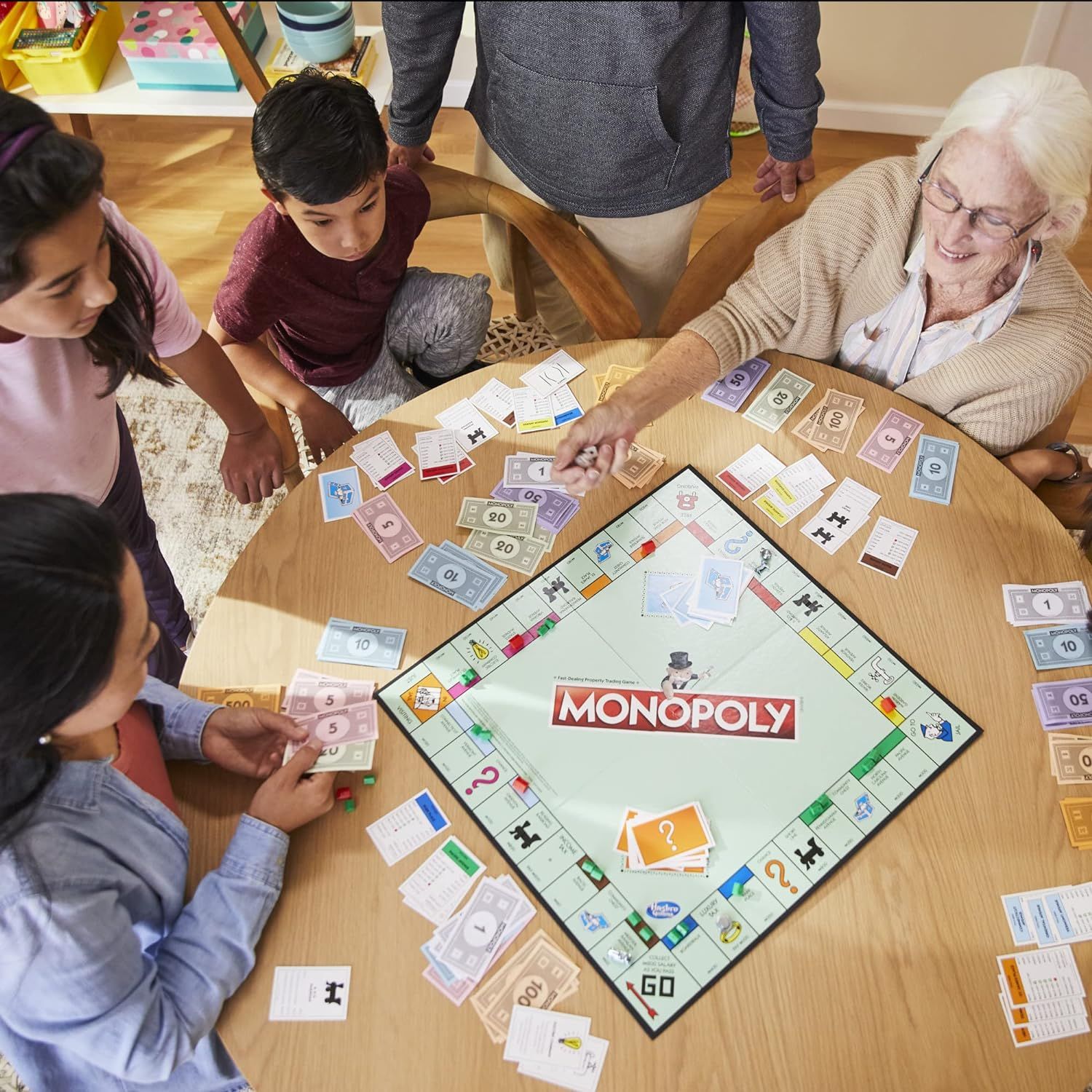 Demonstrates the product being enjoyed in a real-world family setting, showing its appeal across different age groups and its role in bringing people together…