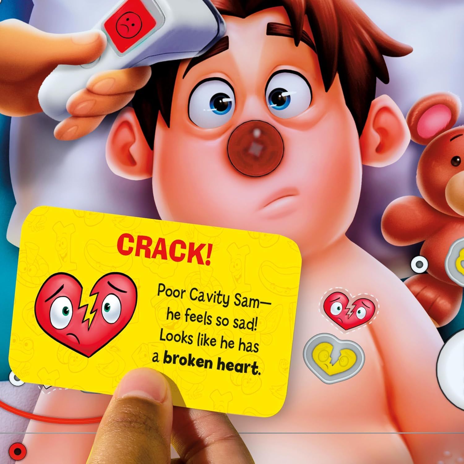 Demonstrates how the interactive game works, showing children how to use the thermometer tool to find cavities on the character, making dental health education fun and engaging.