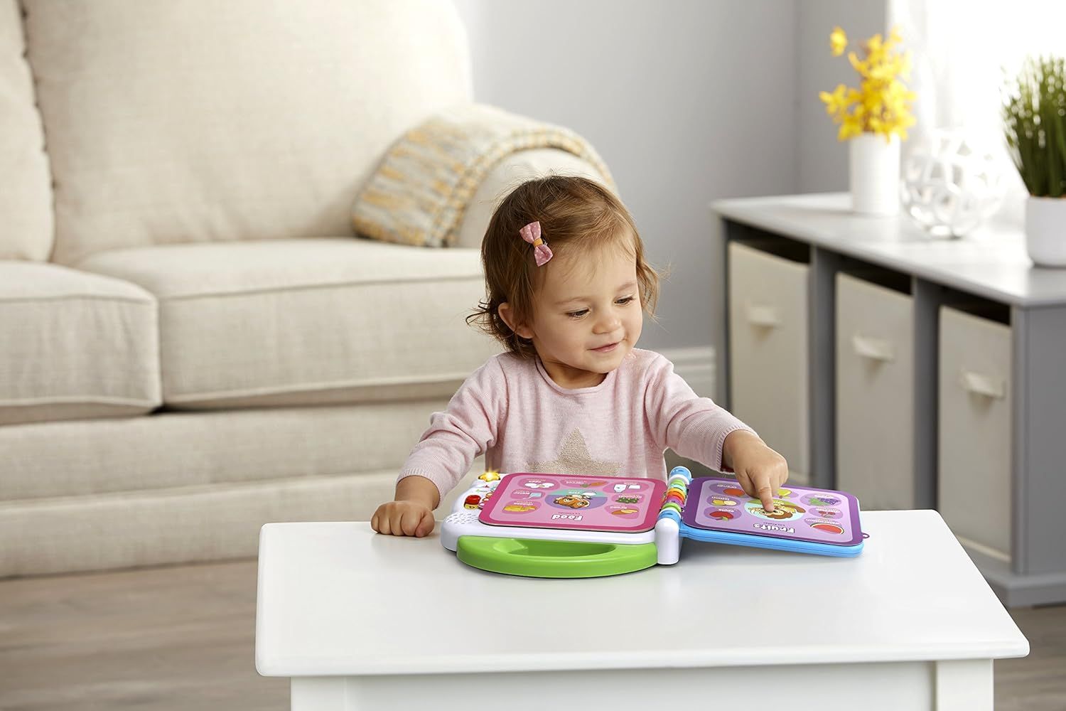 Demonstrates the product being used by a young child in a real home environment to help parents visualize how their child would interact with and enjoy the toy.