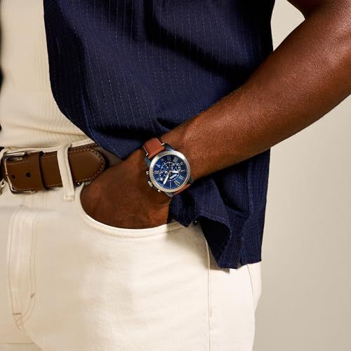 Demonstrates the product worn in a real-world setting to help shoppers visualize how the watch looks when styled with everyday clothing.