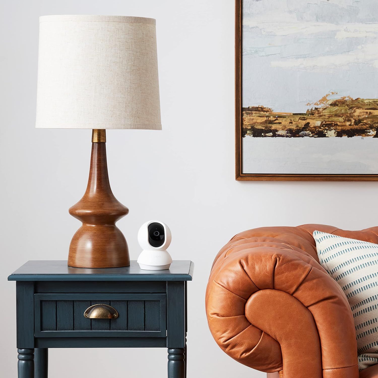 Demonstrates how the product (security camera) fits naturally into a stylish home environment, reassuring shoppers that it won't disrupt their interior design…