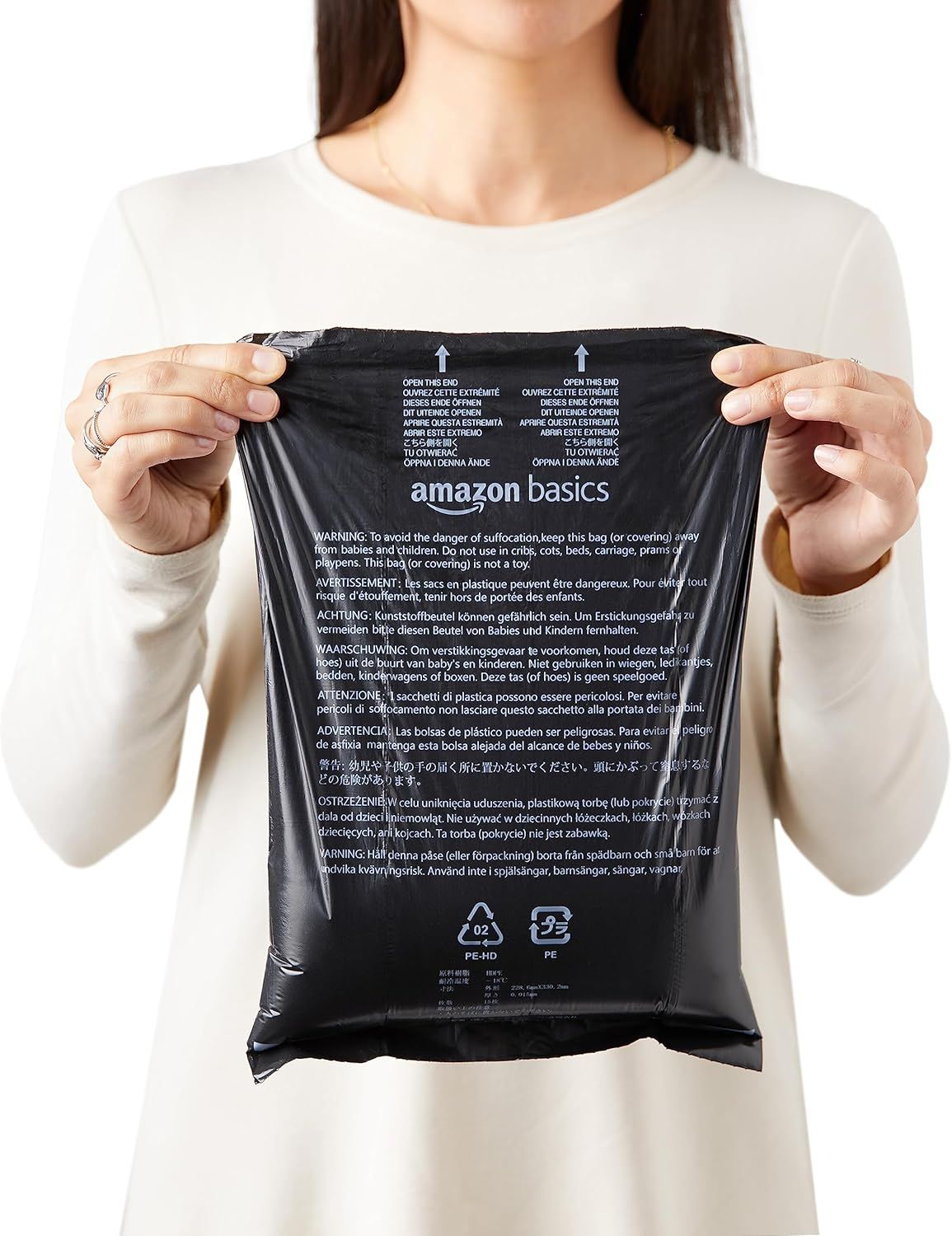 Communicates critical safety warnings about suffocation hazards in multiple languages and displays recycling information to reassure shoppers about safe usage and environmental responsibility.