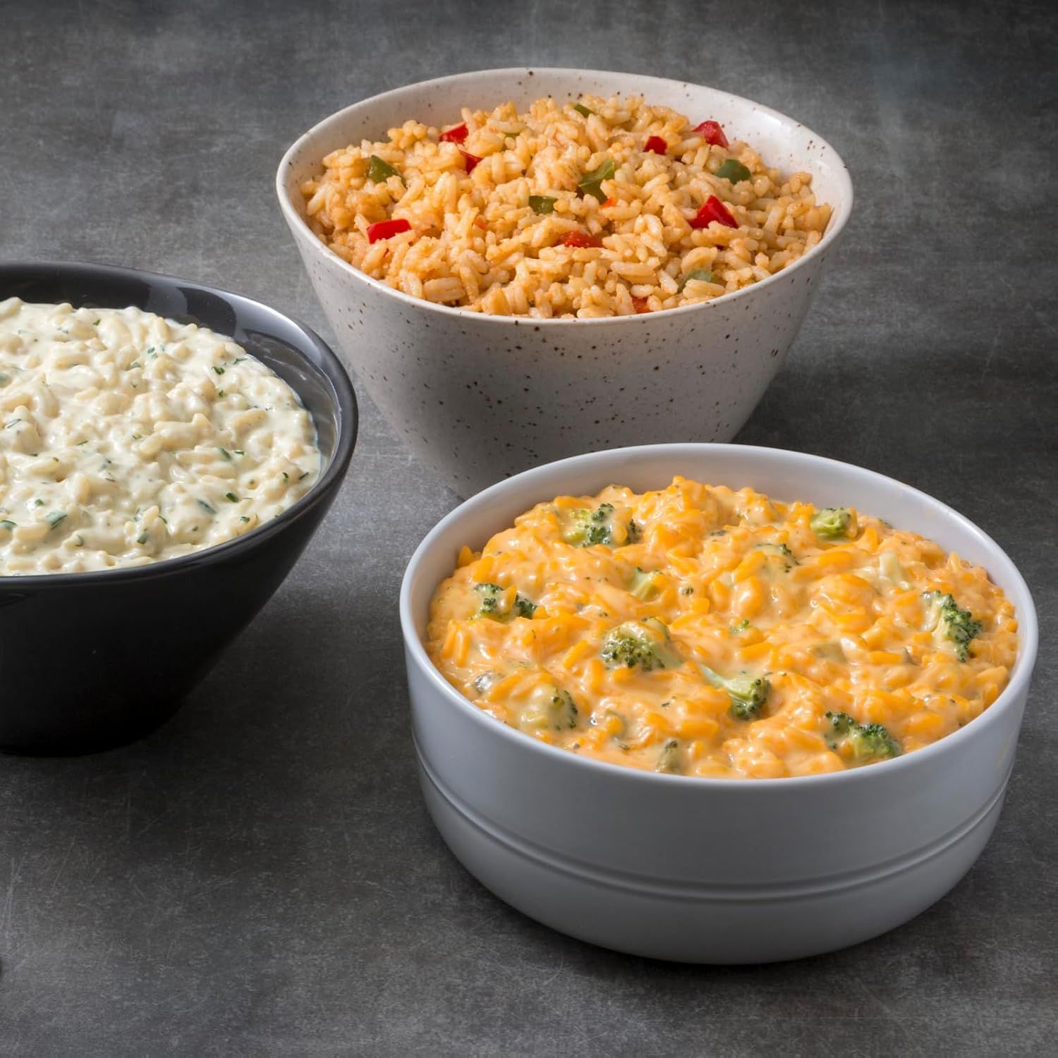 Displays the brand's product portfolio by showing three different prepared rice/pasta side dish options, helping shoppers understand the variety available and…