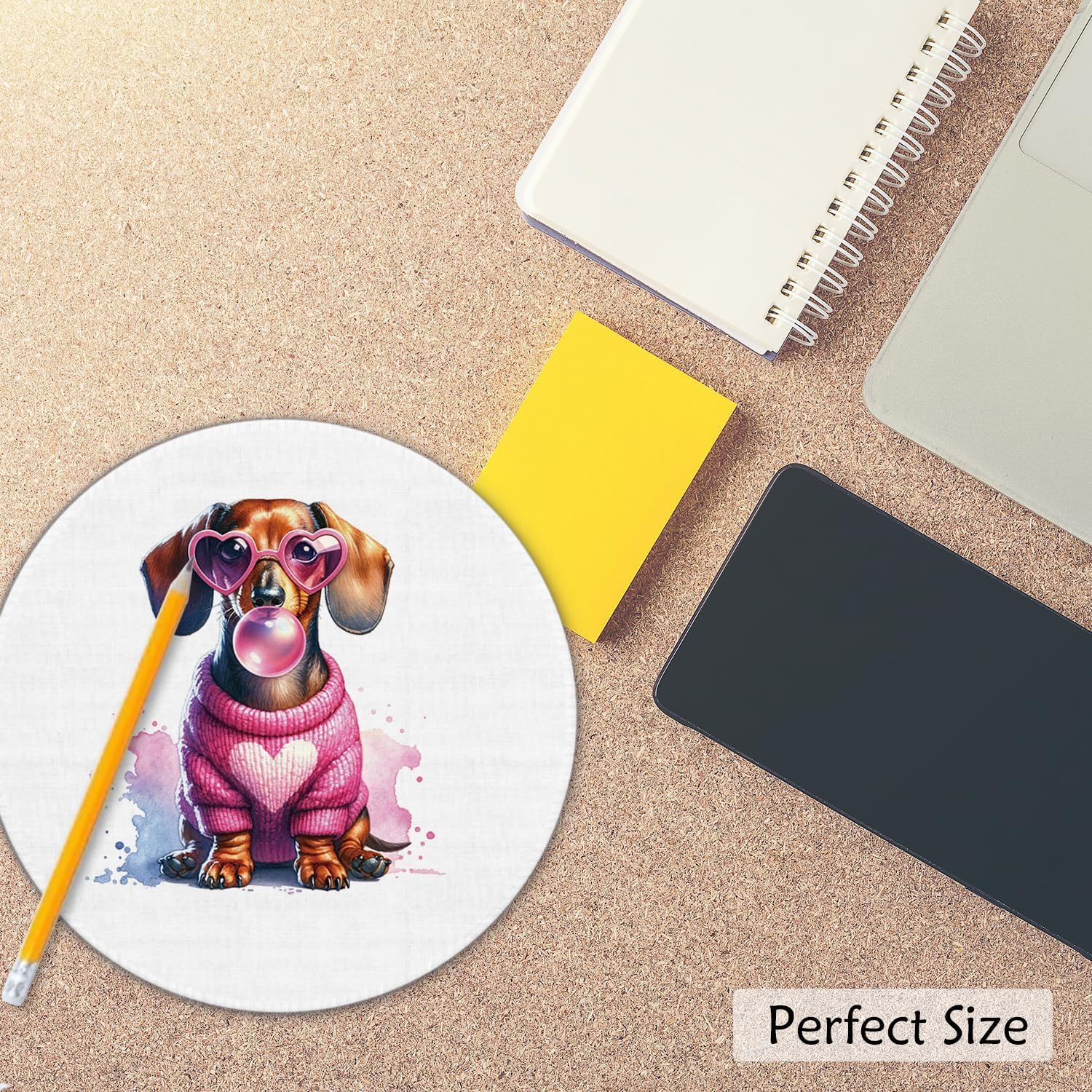 Demonstrates the product's size by showing it in context with everyday office items like a laptop, notebook, and pencil to help shoppers visualize its dimensions and portability.