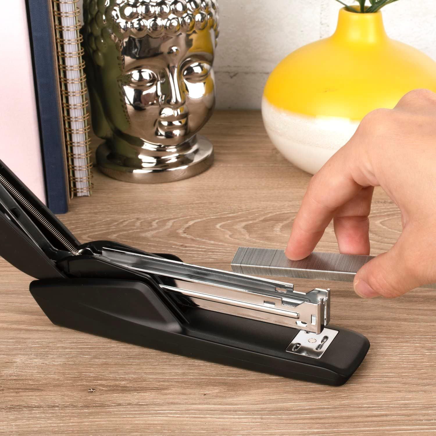 Demonstrates the product being used in a real-world office or home setting to help shoppers visualize how the stapler fits naturally into their workspace.