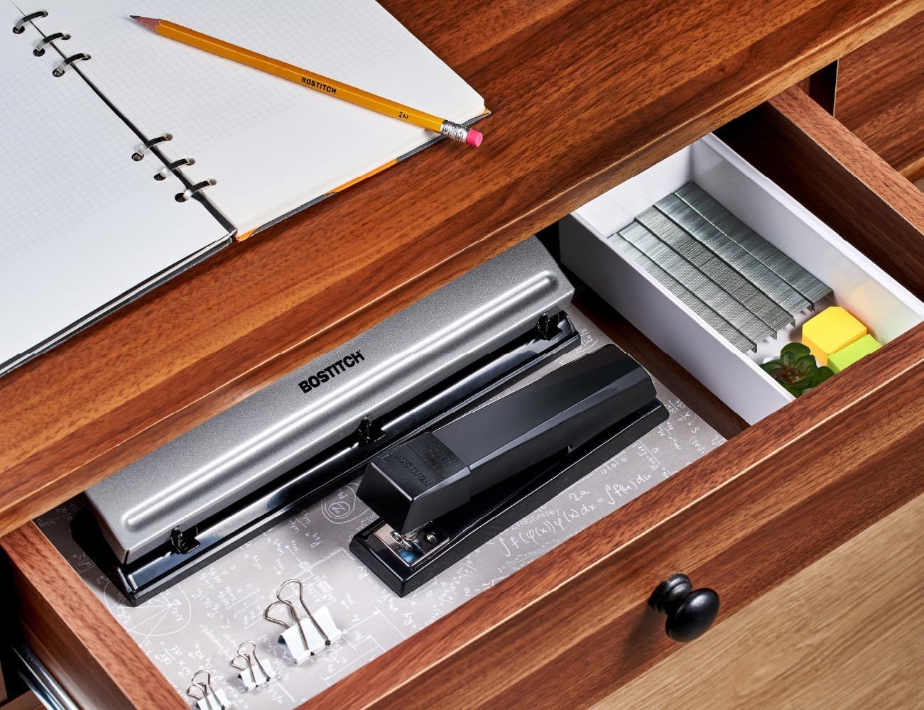 Demonstrates the product in a real-world office environment to show how it fits naturally into a workspace and helps keep desk supplies organized.