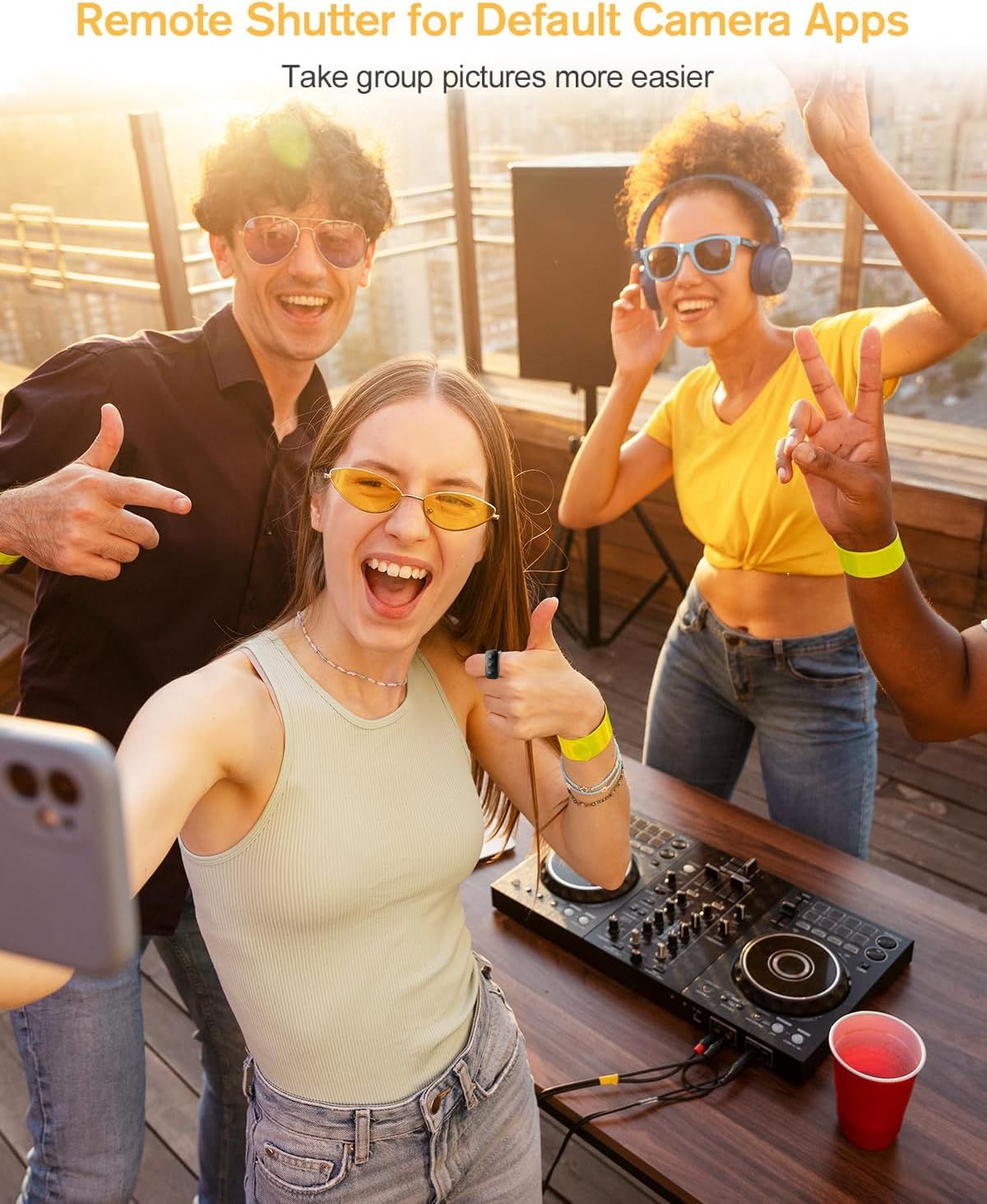 Demonstrates how the remote shutter feature makes it easier to take group pictures by allowing everyone to be in the photo without needing someone to hold the…