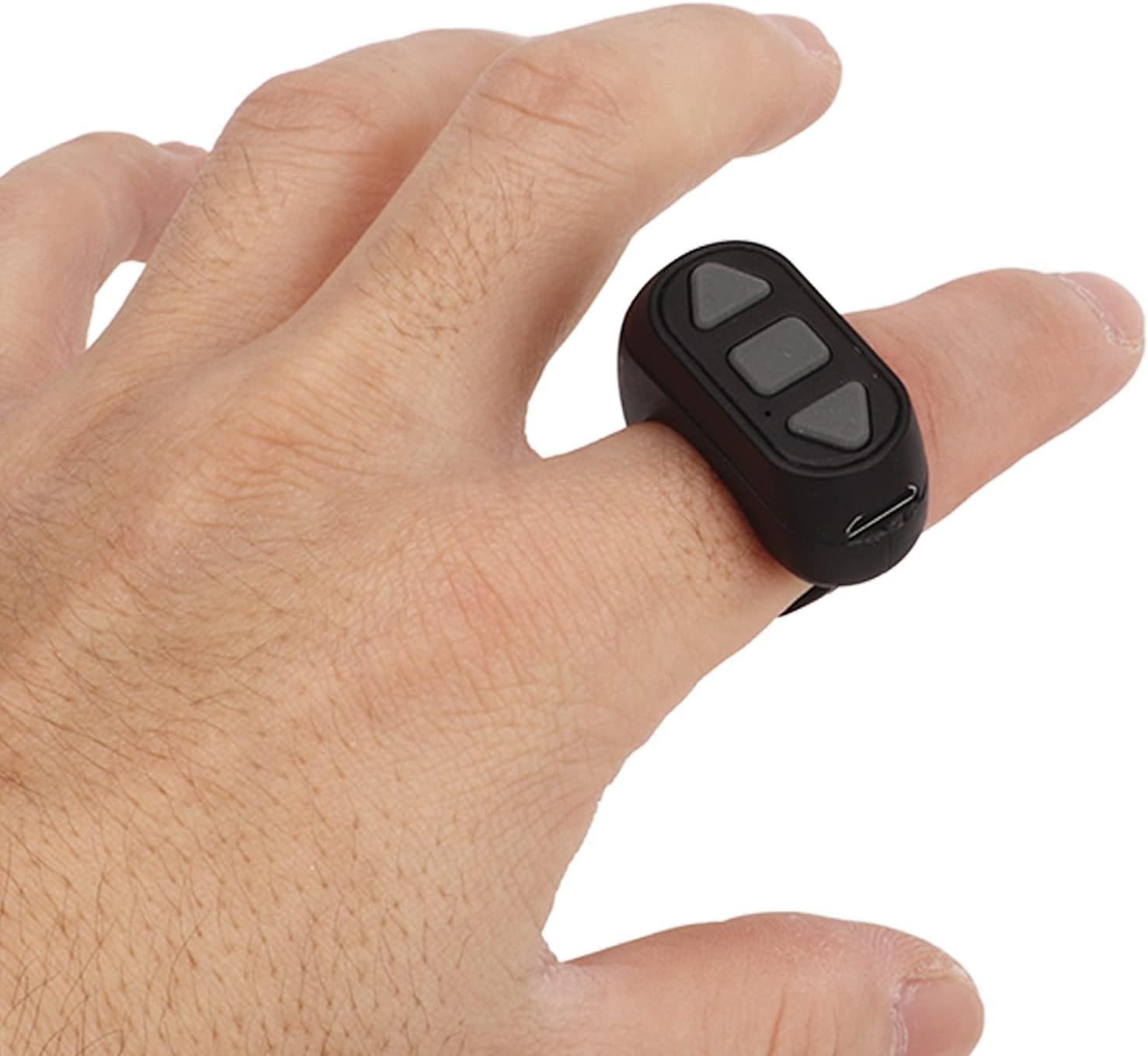Demonstrates how the product is worn and used in a real-world context, showing the finger-mounted design and button layout to help shoppers visualize the product in use.