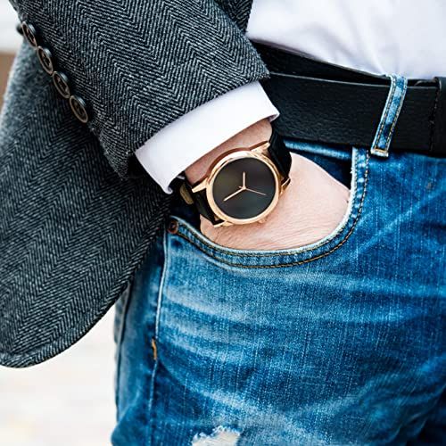 Demonstrates the watch worn in a real-world fashion context to help shoppers visualize how the product looks when styled with everyday clothing.