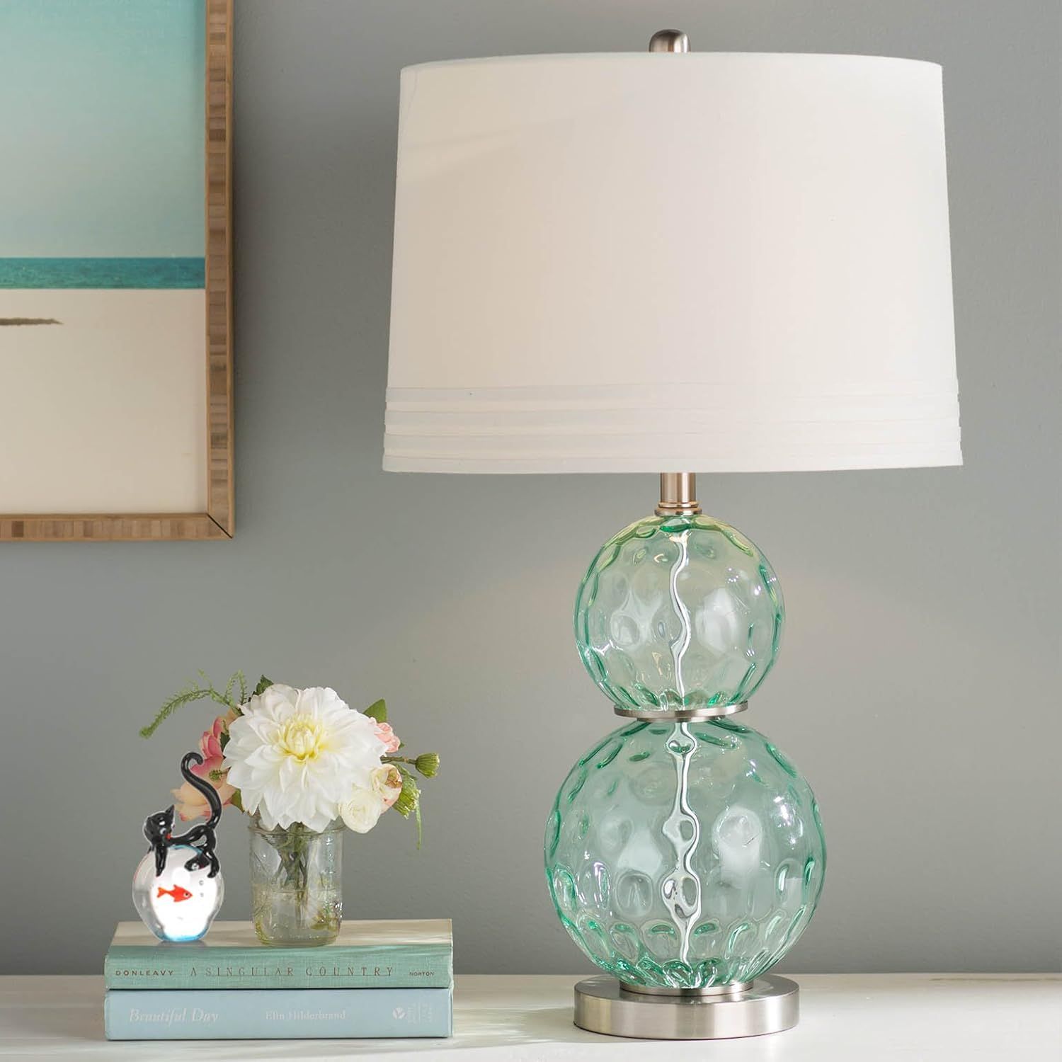 Showcases the lamp in a styled home environment to help shoppers visualize how the product looks in a real-world setting and fits with their decor.