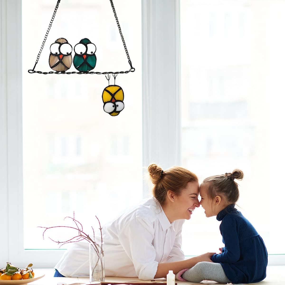 Demonstrates the product as a charming decorative piece in a real home setting, showing how it enhances a bright, family-friendly living space.