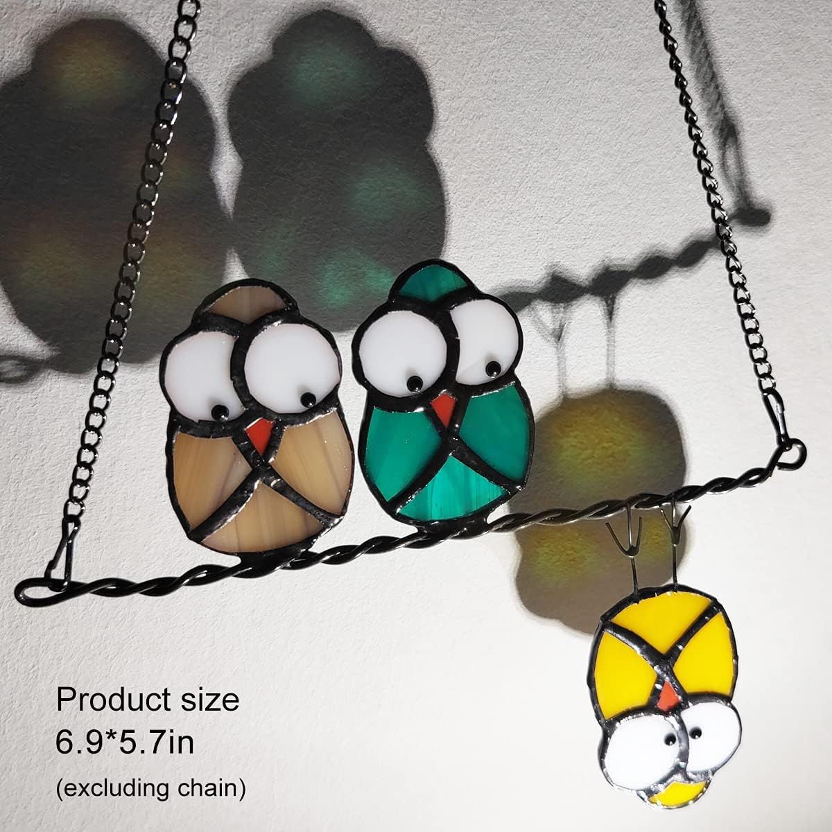 Communicates the exact physical size of the product (6.9 x 5.7 inches excluding chain) to help shoppers understand how large the decorative bird ornament will be when displayed.