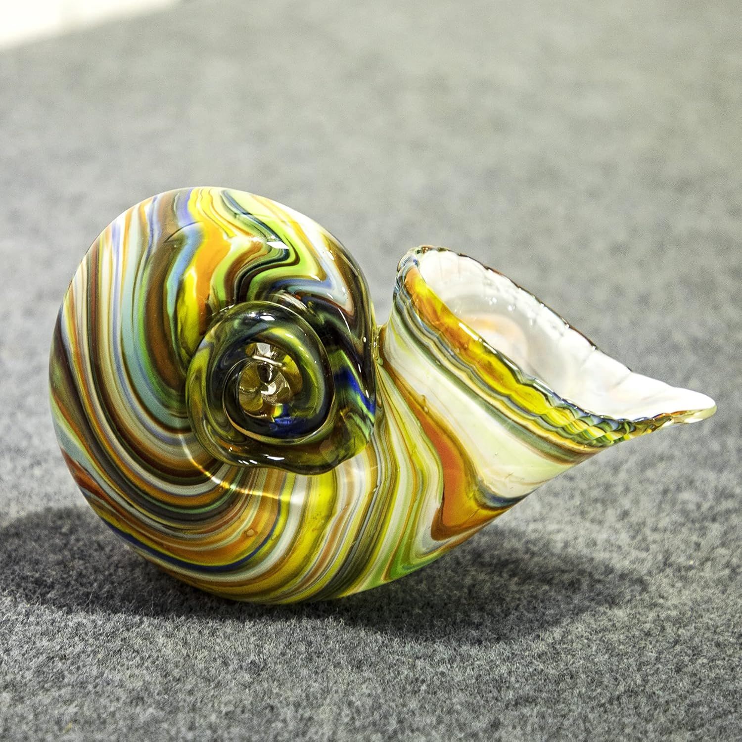 Provides a clear, distraction-free view of the decorative glass snail figurine, allowing shoppers to appreciate its intricate swirled colors and craftsmanship without any text or design elements.