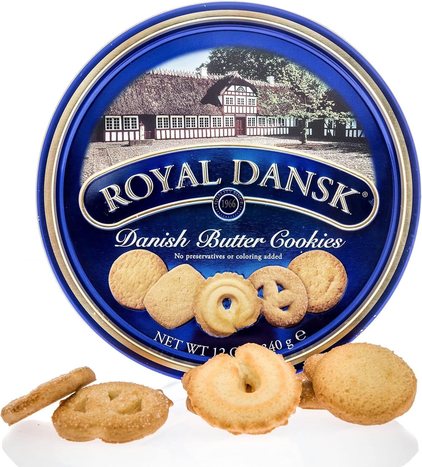 Shows the Royal Dansk Danish Butter Cookies tin packaging with sample cookies displayed in front, allowing shoppers to see both the iconic blue tin and the…