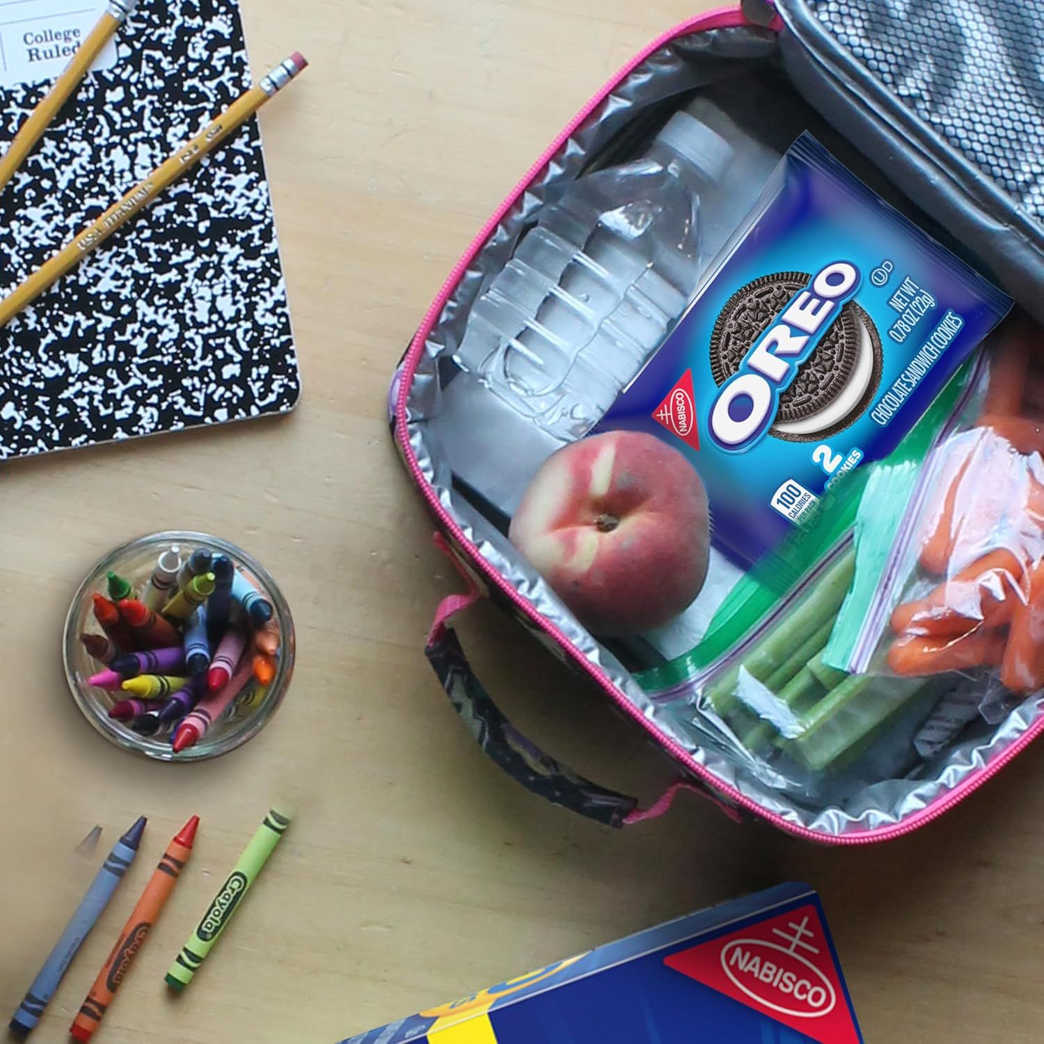 Demonstrates the product in a real-world back-to-school context, showing Oreos as part of a student's lunch to create relatable, everyday usage appeal.