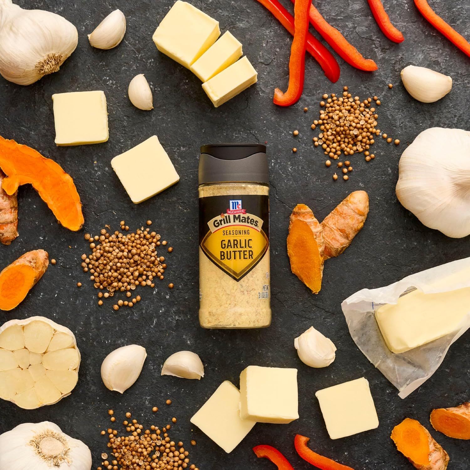 Showcases the product alongside complementary fresh ingredients (garlic, butter, peppers, ginger, spices) to inspire culinary use and demonstrate recipe…