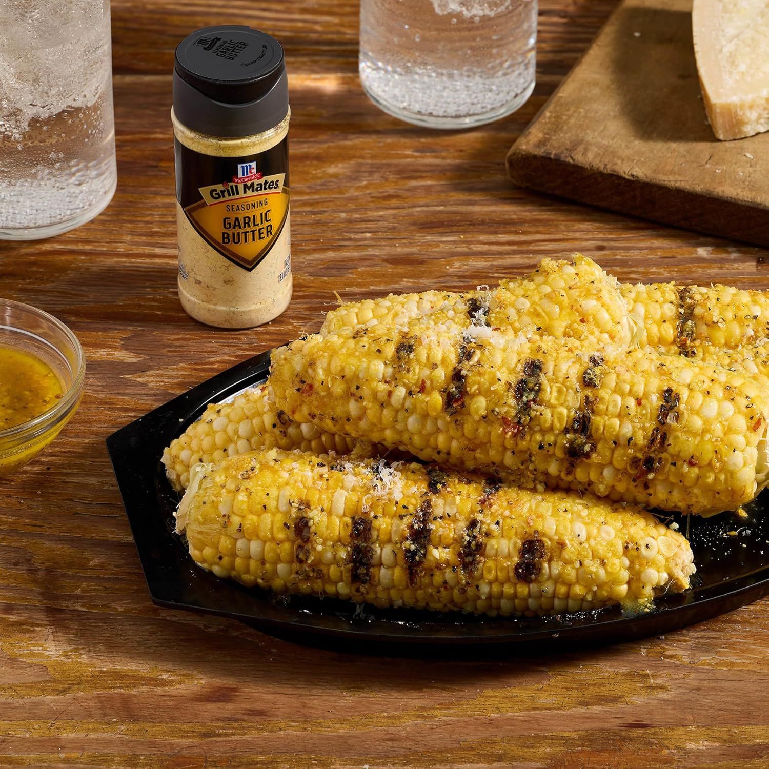 Demonstrates the product in a real-world grilling context, showing the finished result of seasoned grilled corn to help shoppers visualize how they can use…