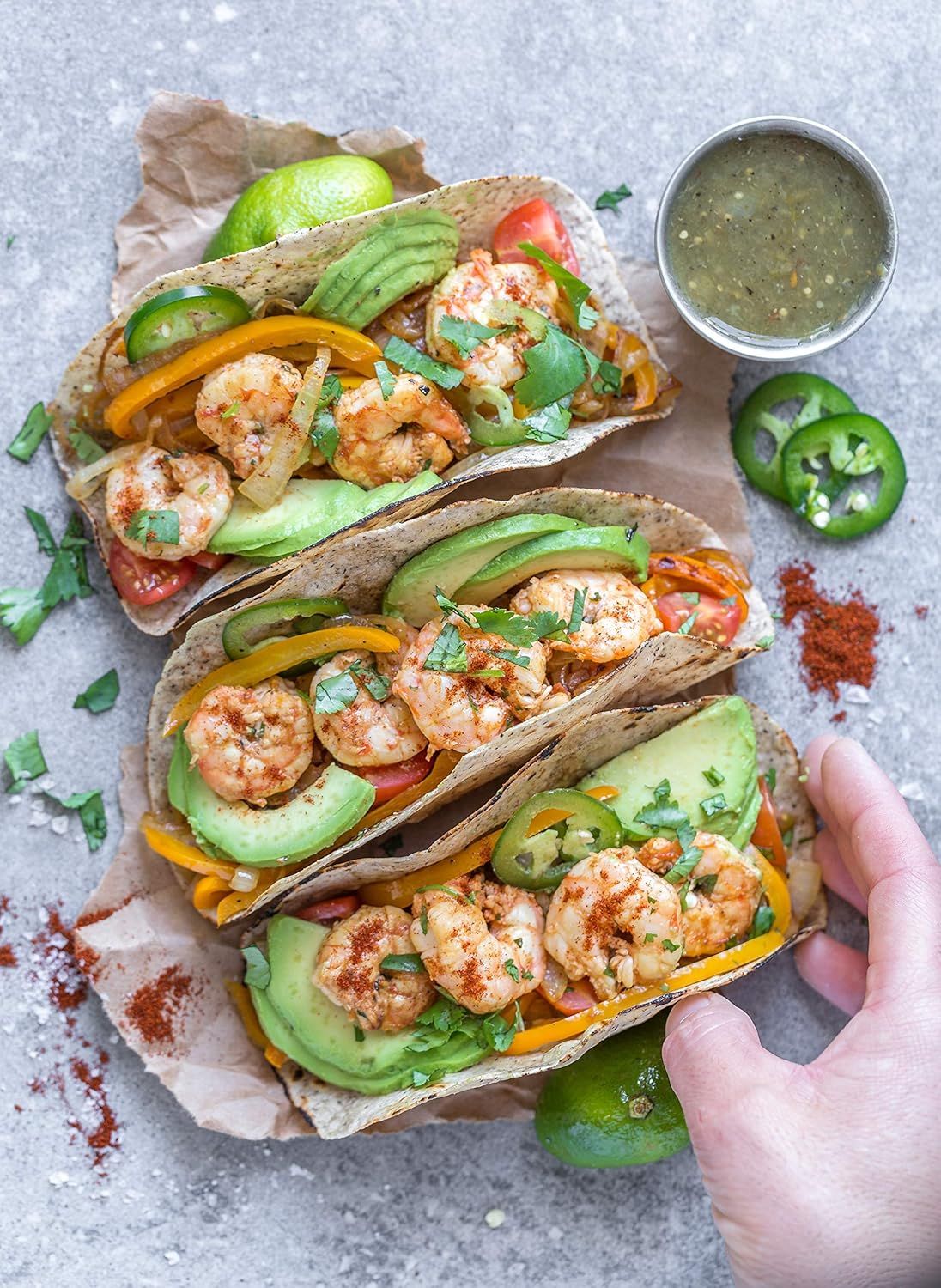 Showcases the product (shrimp tacos) in an authentic, appetizing real-world setting to help shoppers visualize the meal and create desire through beautiful…