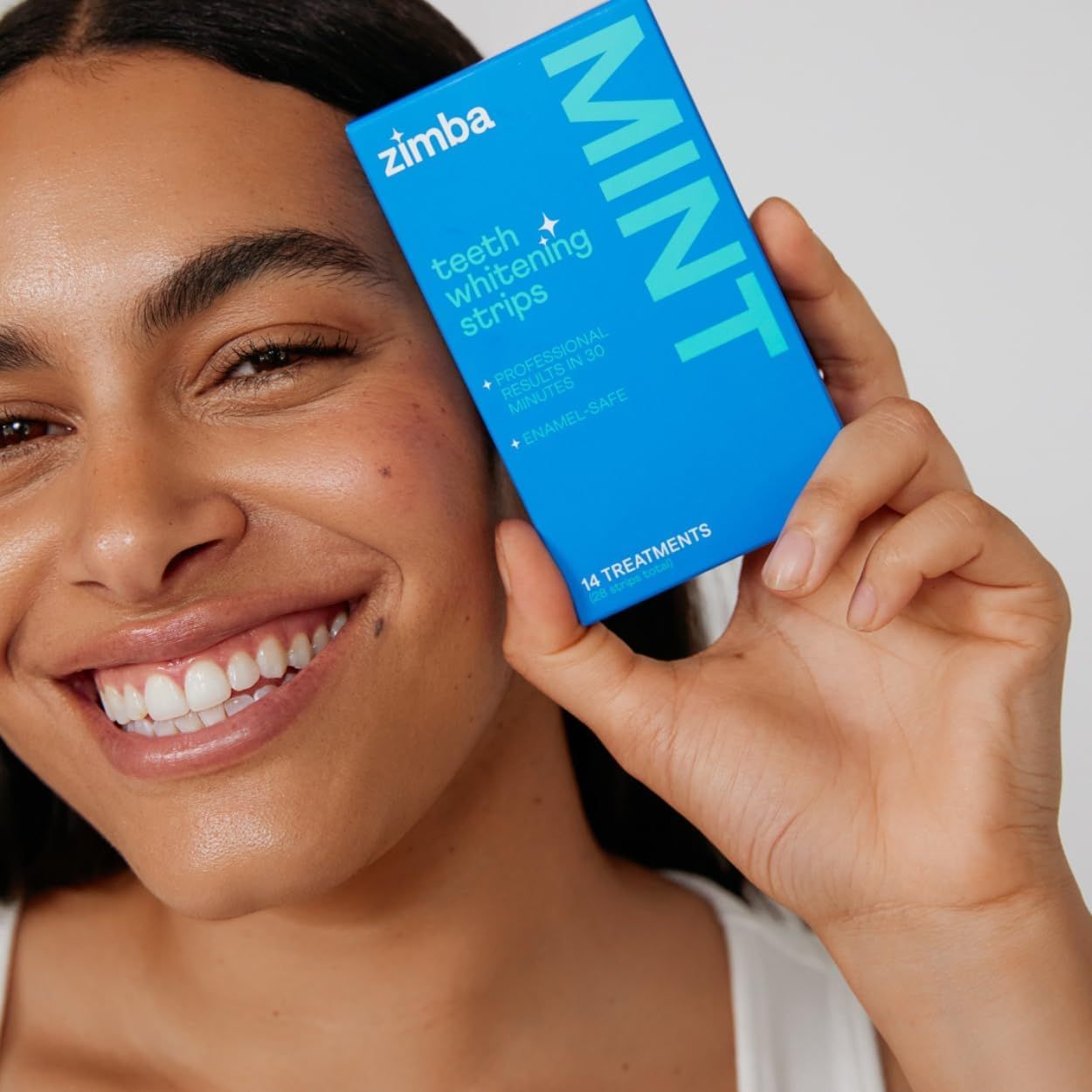 Uses authentic user-generated style photography to build trust and show real-world results of the teeth whitening product, making it relatable and credible to potential customers. Shows the product…