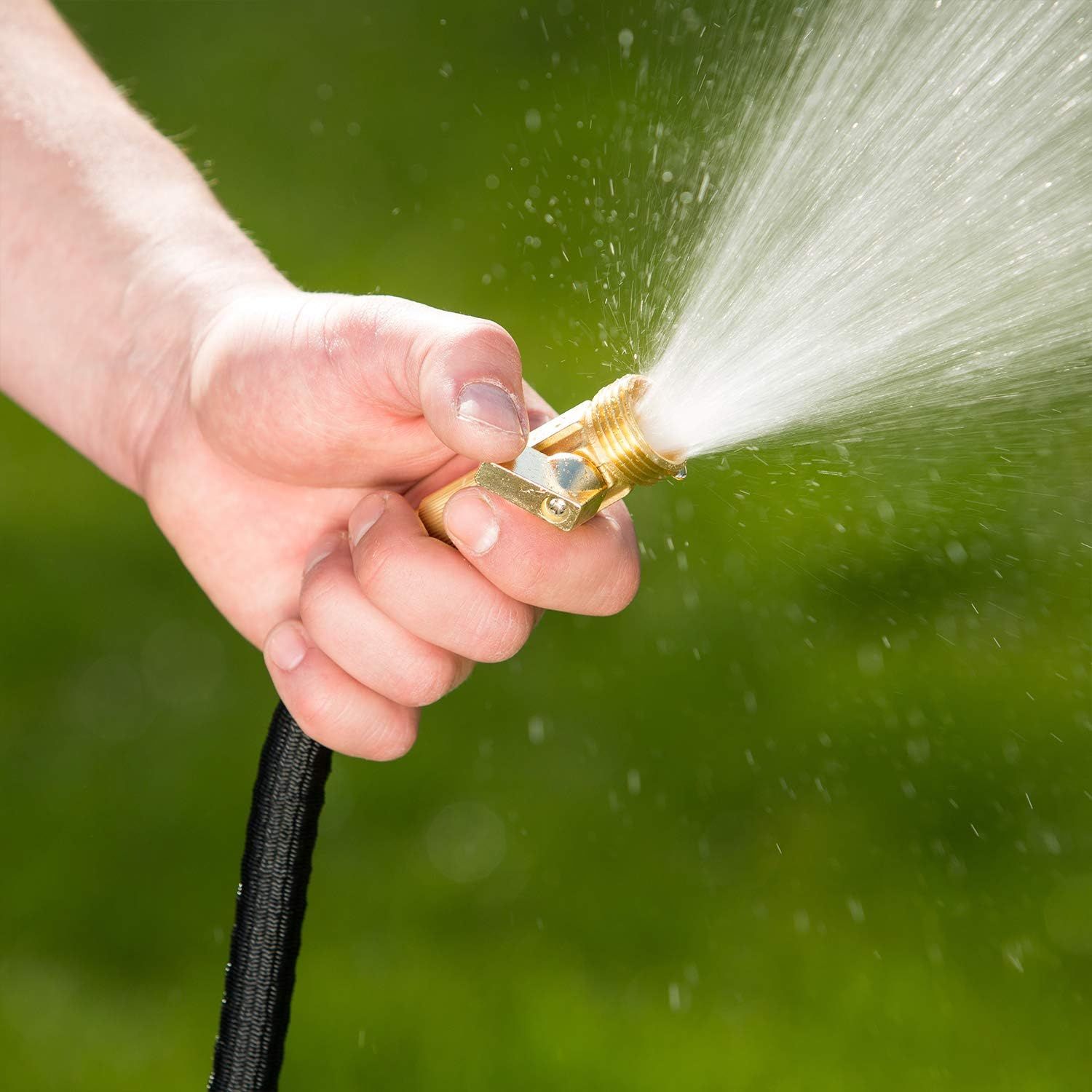 Shows the product being used in a real-world outdoor setting to help shoppers visualize the hose nozzle in action and understand its practical application.