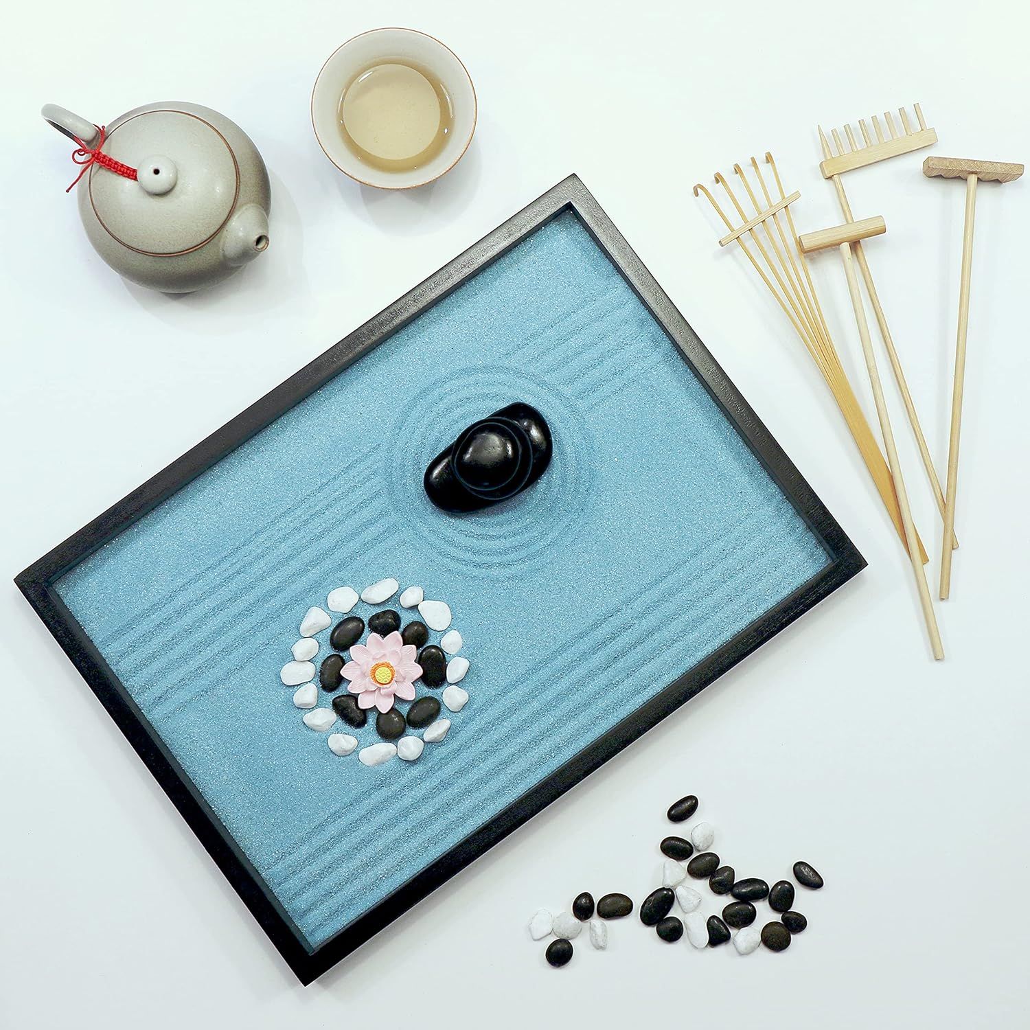 Shows all the items included in the zen garden kit to help shoppers understand the complete set they will receive, including the sand tray, stones, rakes,…