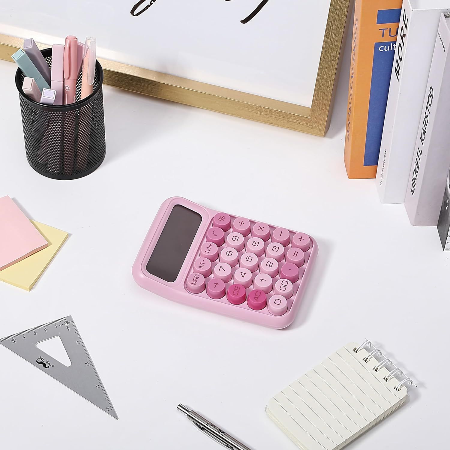 Showcases the pink calculator in a real-world office or study setting to help shoppers visualize how the product fits into their daily workspace and lifestyle.