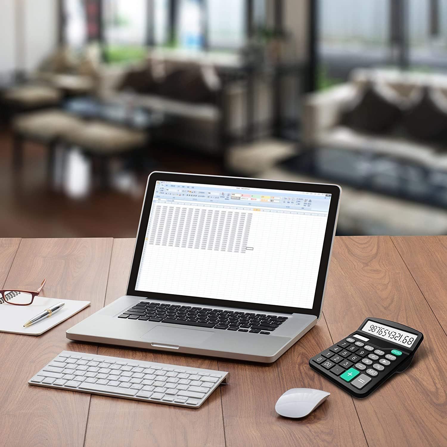 Demonstrates the product (calculator) in a real-world professional office setting to help shoppers visualize how it fits into their workspace and daily work…