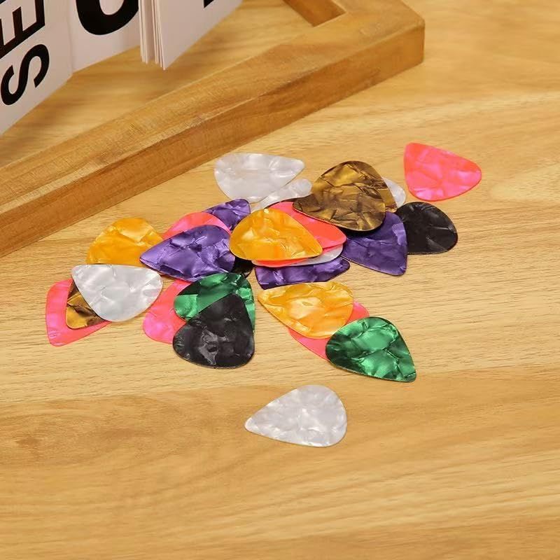 Shows the guitar picks displayed in a natural home or studio environment to help shoppers visualize the product in everyday use.