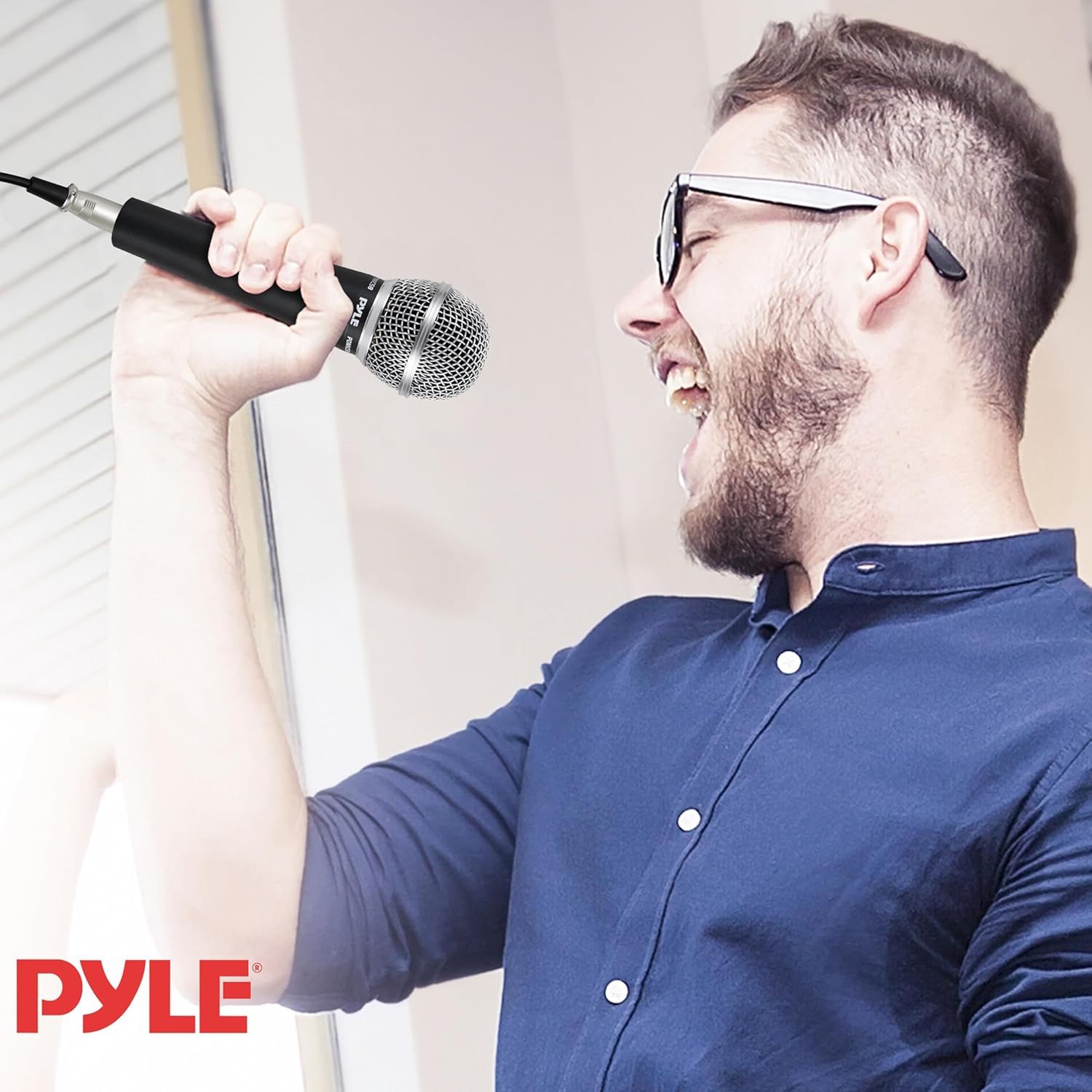 Demonstrates the product being used in a real-world setting to help shoppers visualize themselves using the microphone for singing, karaoke, or performance.