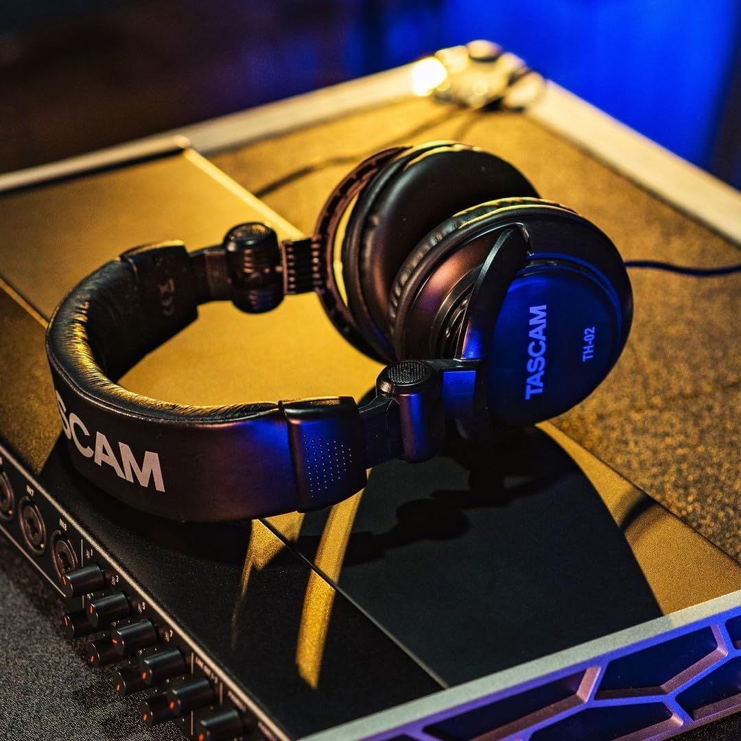 Showcases the headphones in a real-world professional audio/gaming environment to help shoppers visualize the product in use and establish its premium…